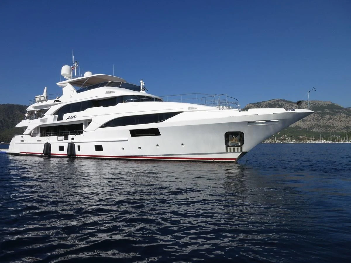 a white yacht in the water aboard ORYX Yacht for Sale