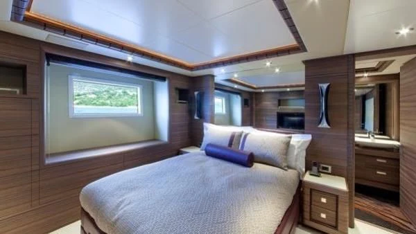 a bed in a room aboard ORYX Yacht for Sale