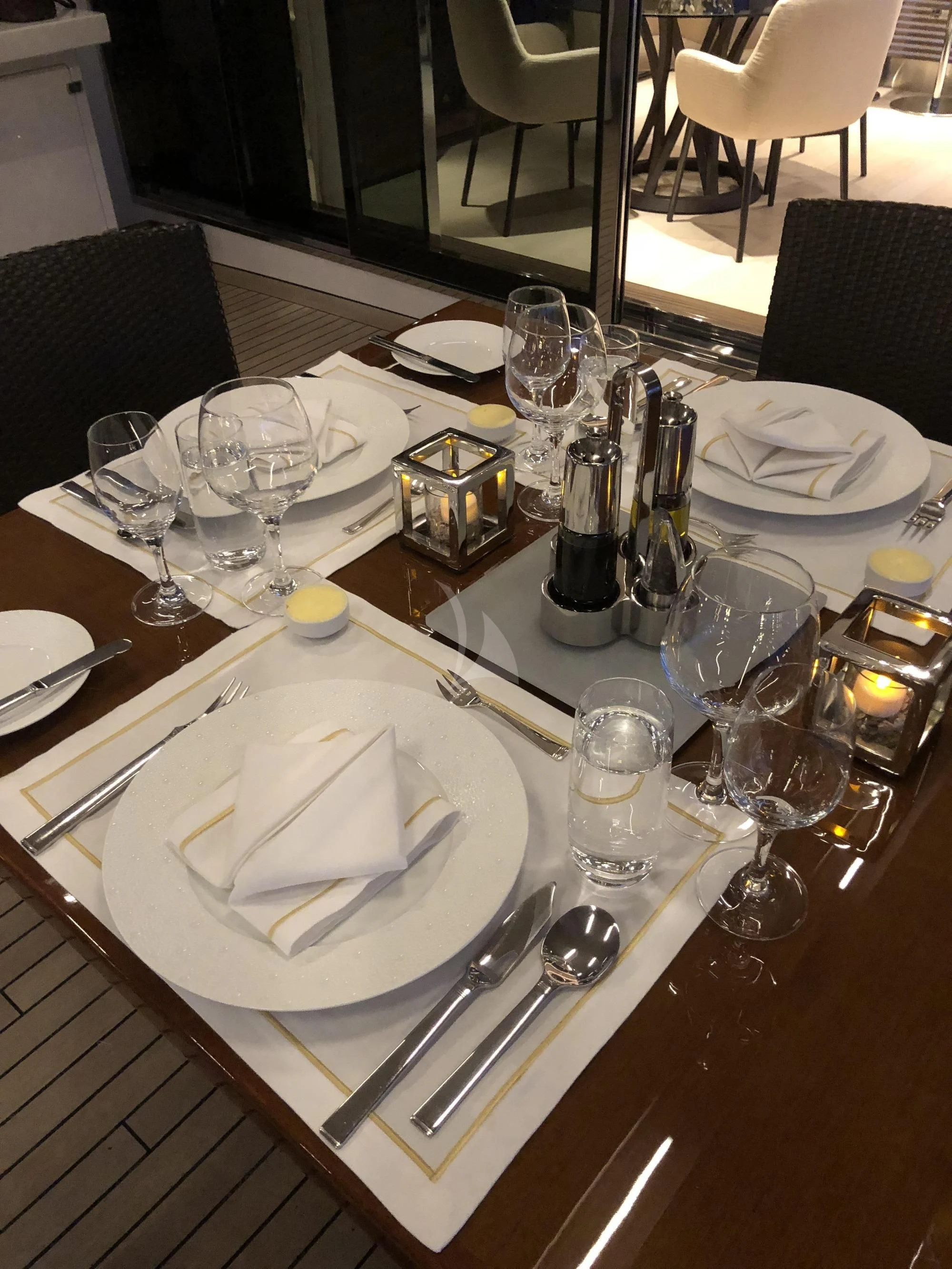 a table with plates and silverware aboard ORYX Yacht for Sale