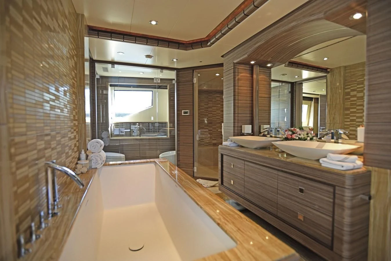 a bathroom with a large bathtub aboard ORYX Yacht for Sale