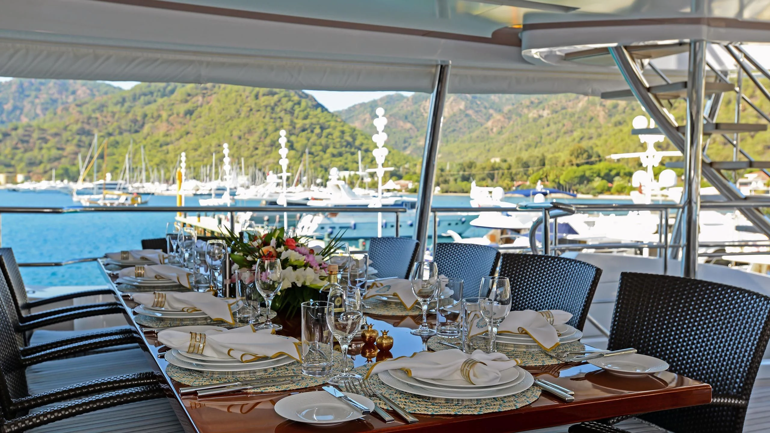 a table set for a dinner aboard ORYX Yacht for Sale