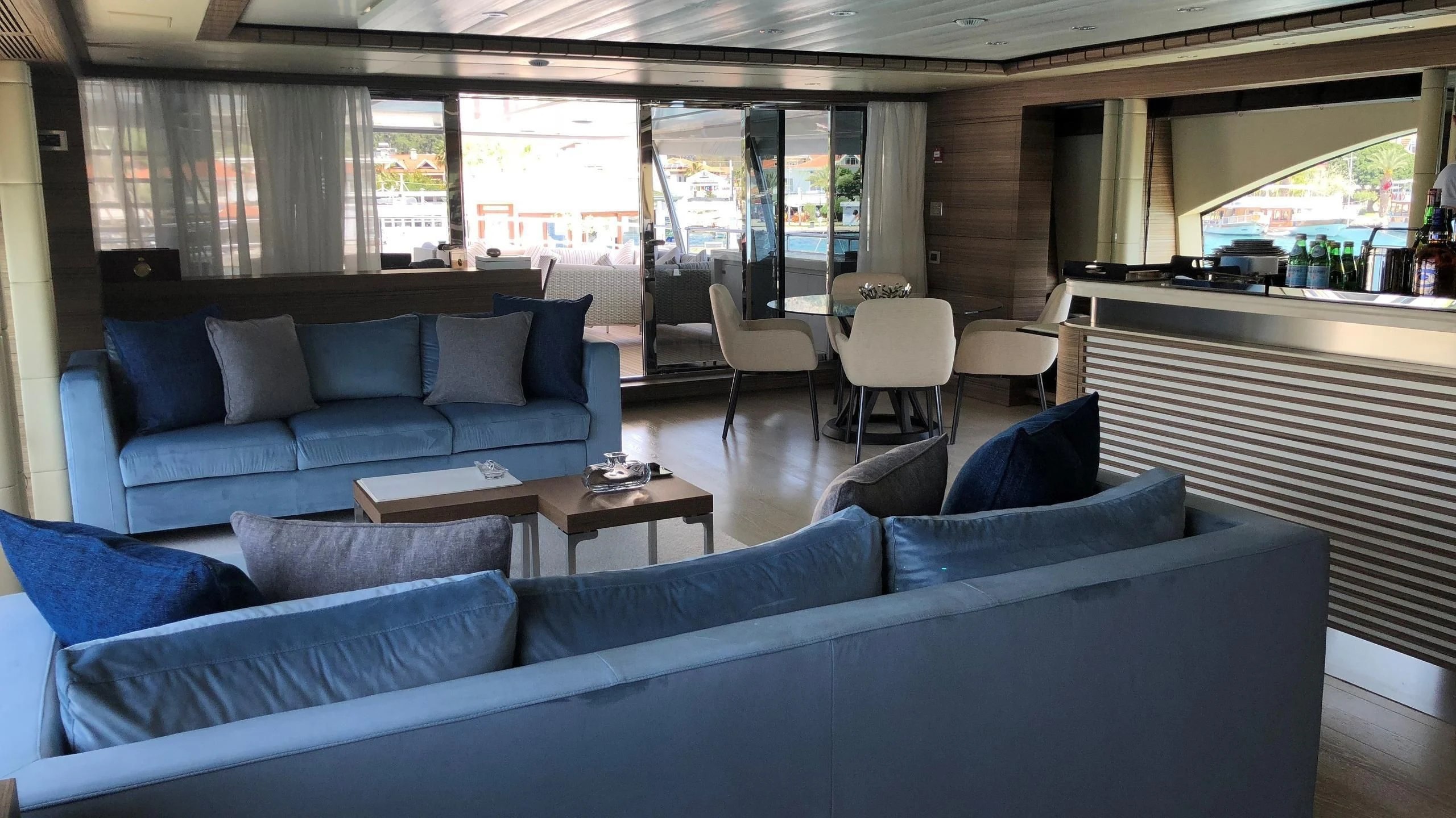 a living room with a couch and a table aboard ORYX Yacht for Sale