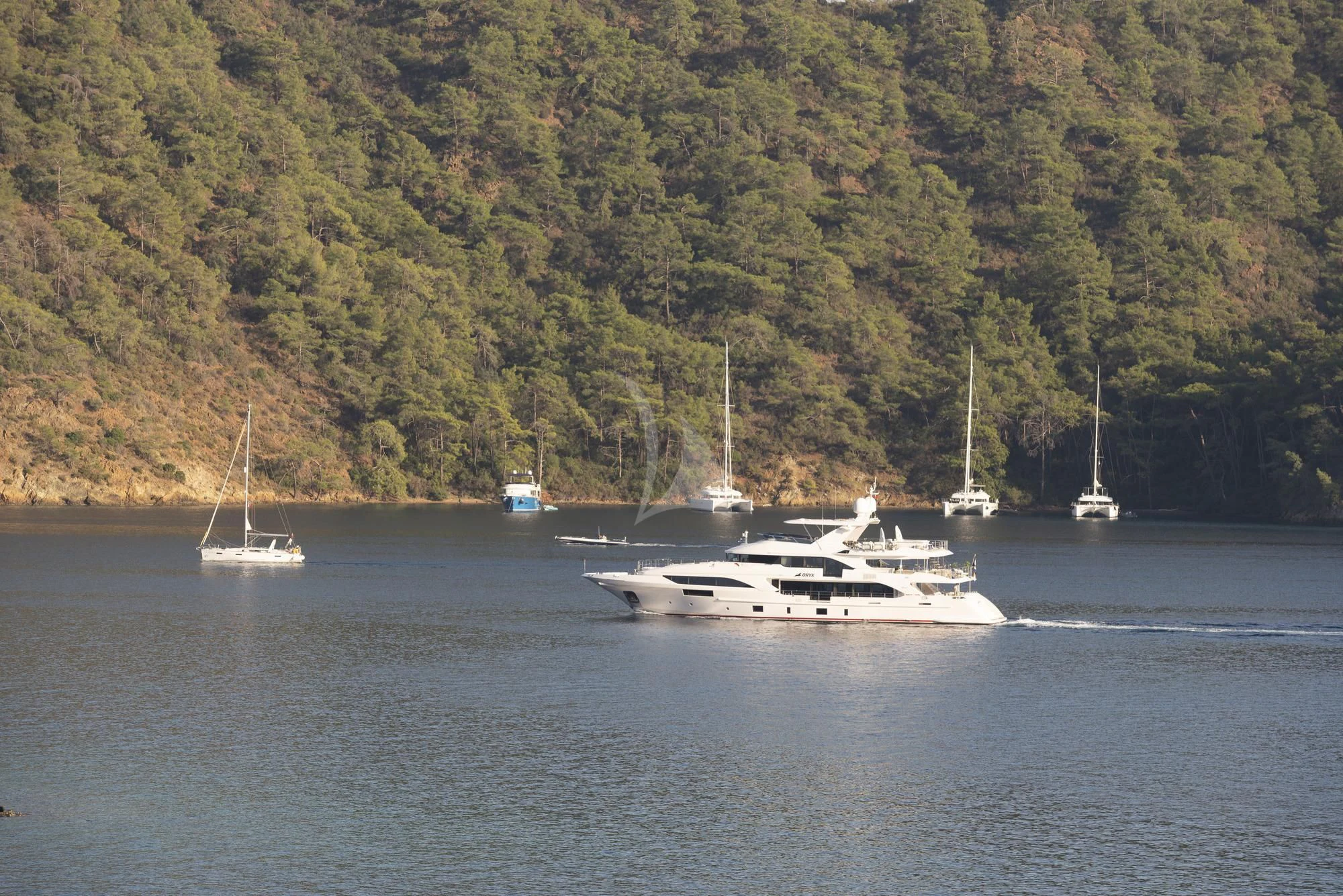 a group of boats on the water aboard ORYX Yacht for Sale