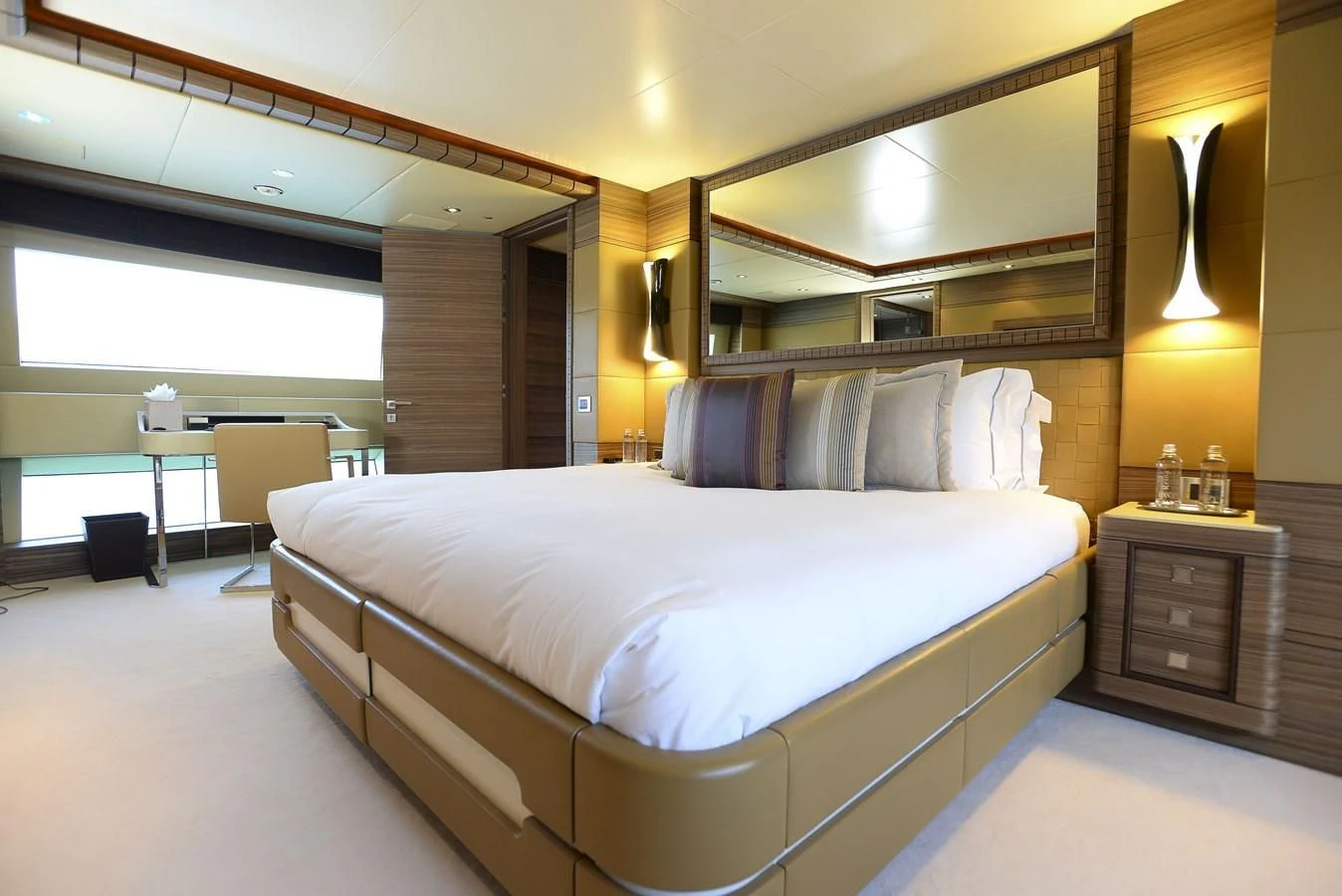 a large bed in a room aboard ORYX Yacht for Sale