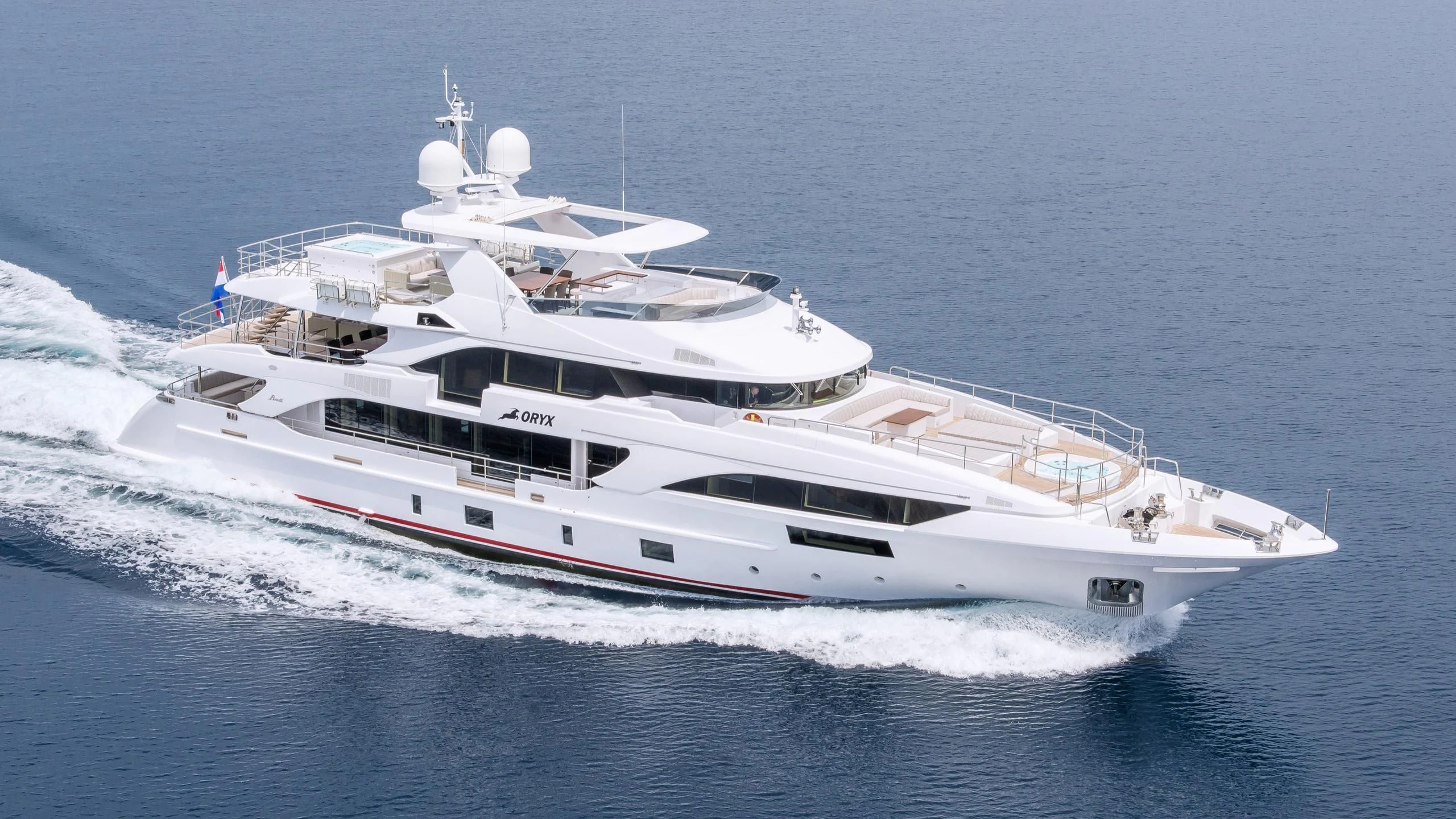 a white yacht on the water aboard ORYX Yacht for Sale