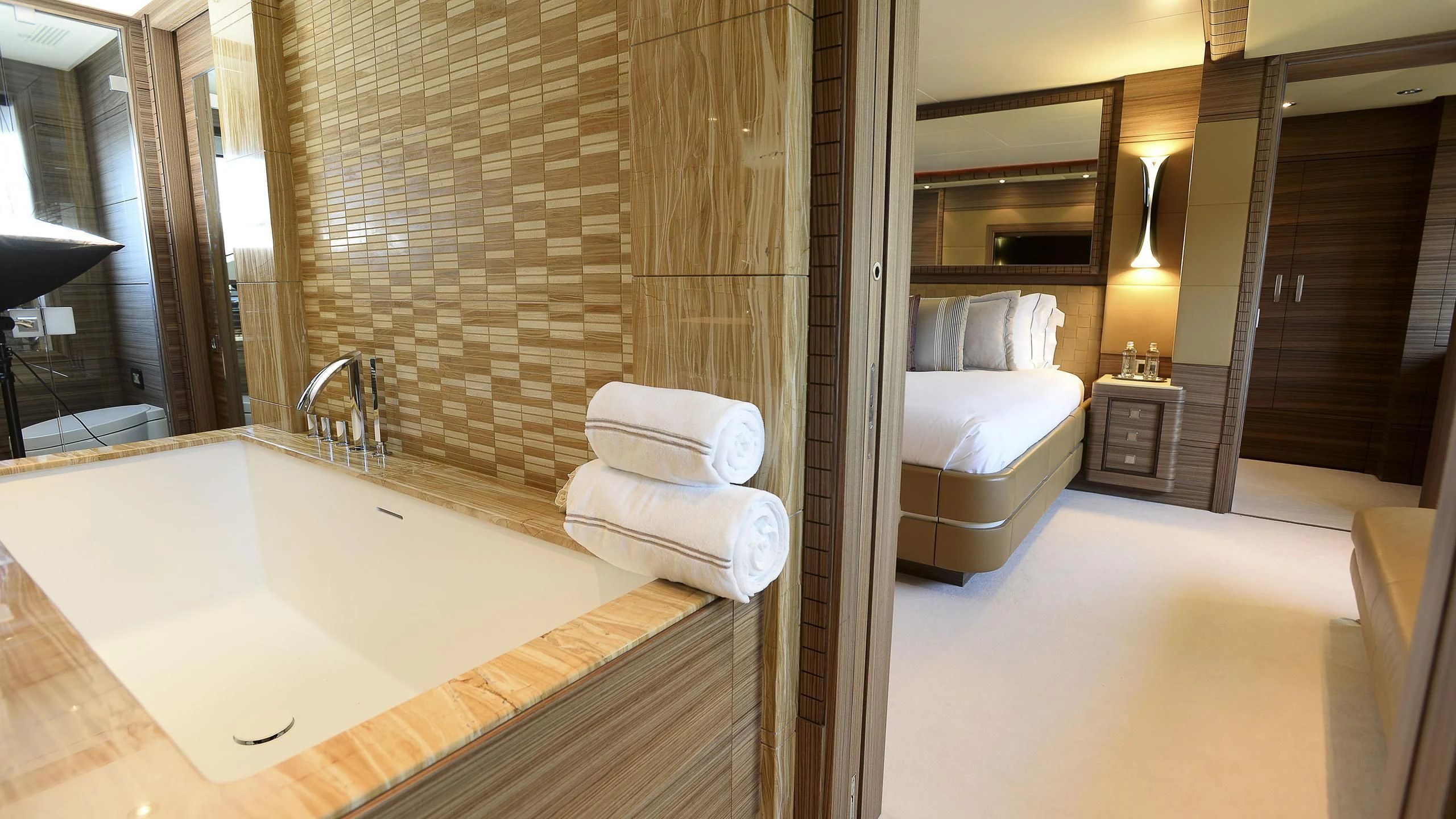 a bathroom with a bathtub and a sink aboard ORYX Yacht for Sale