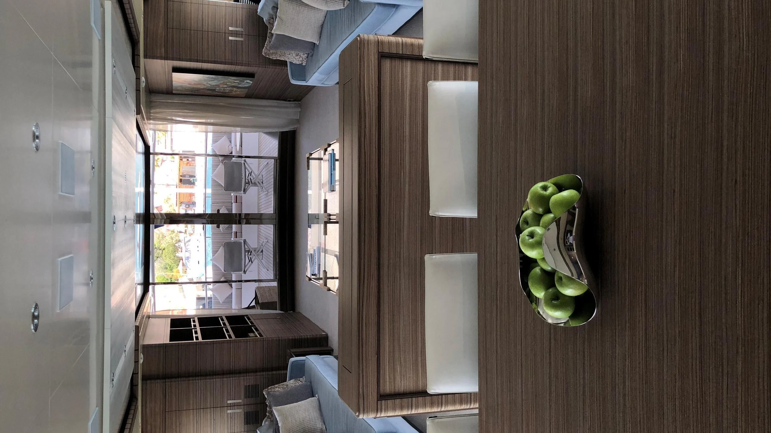a room with a wood wall and a green object on the wall aboard ORYX Yacht for Sale