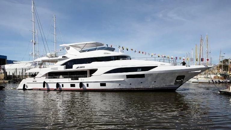 a white yacht in the water aboard ORYX Yacht for Sale