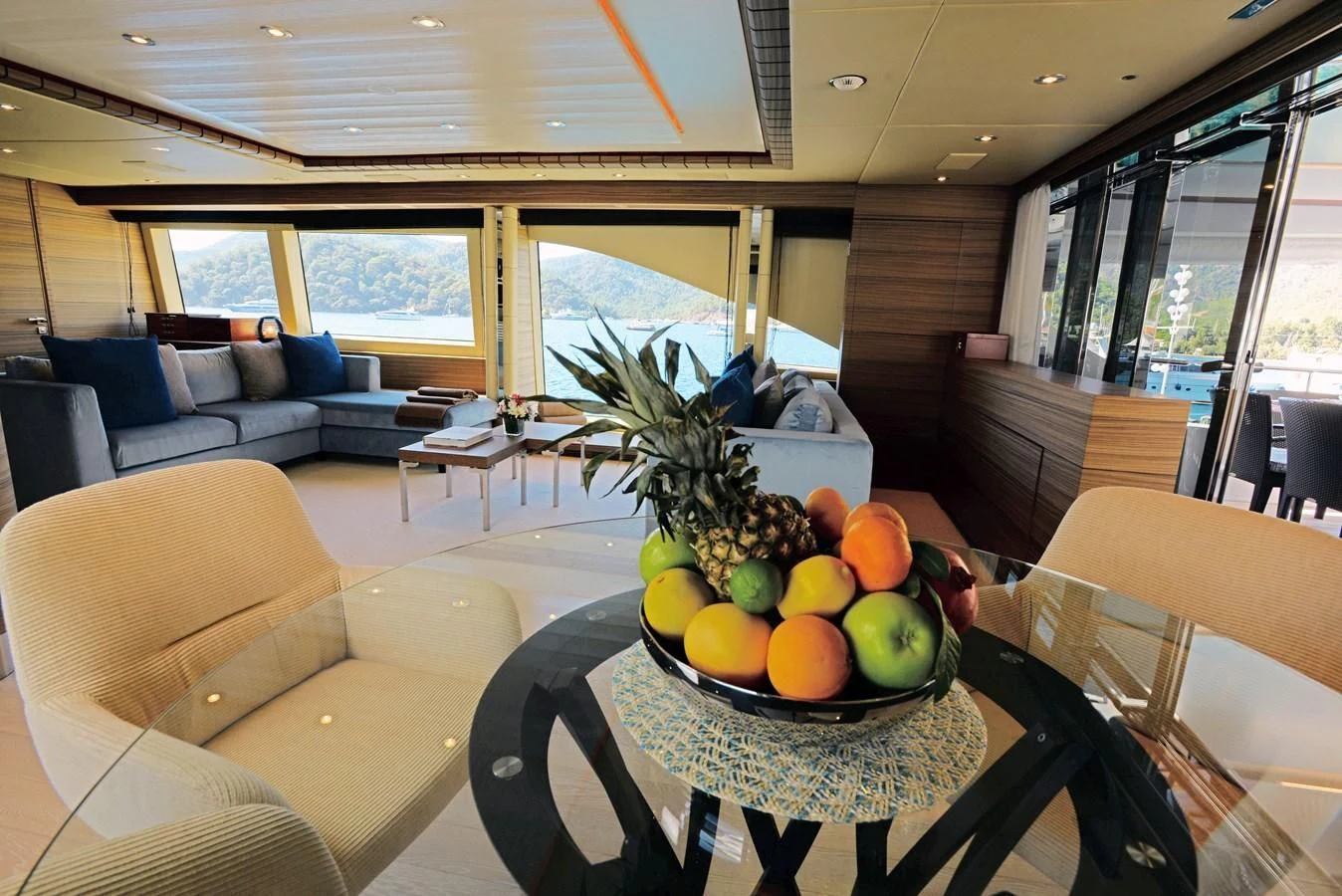 a large room with a table and chairs and a plant in it aboard ORYX Yacht for Sale