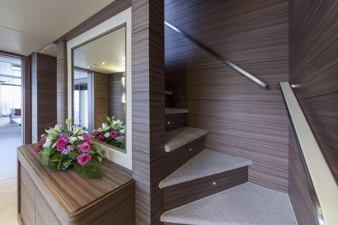 a wood staircase with a flower pot on top aboard ORYX Yacht for Sale