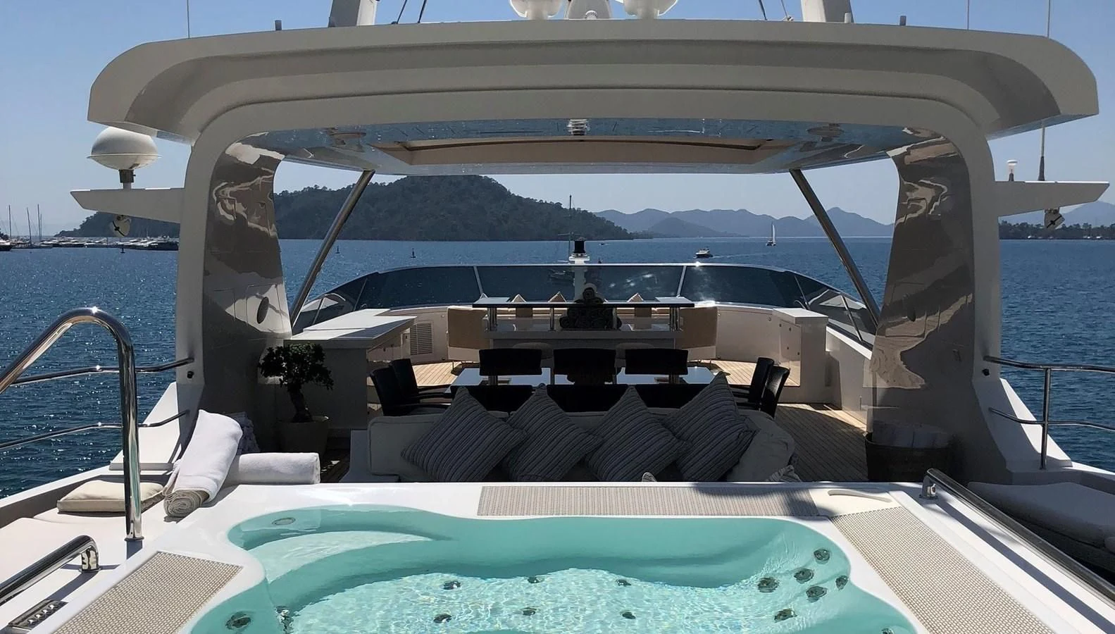 a boat with a large body of water in the background aboard ORYX Yacht for Sale