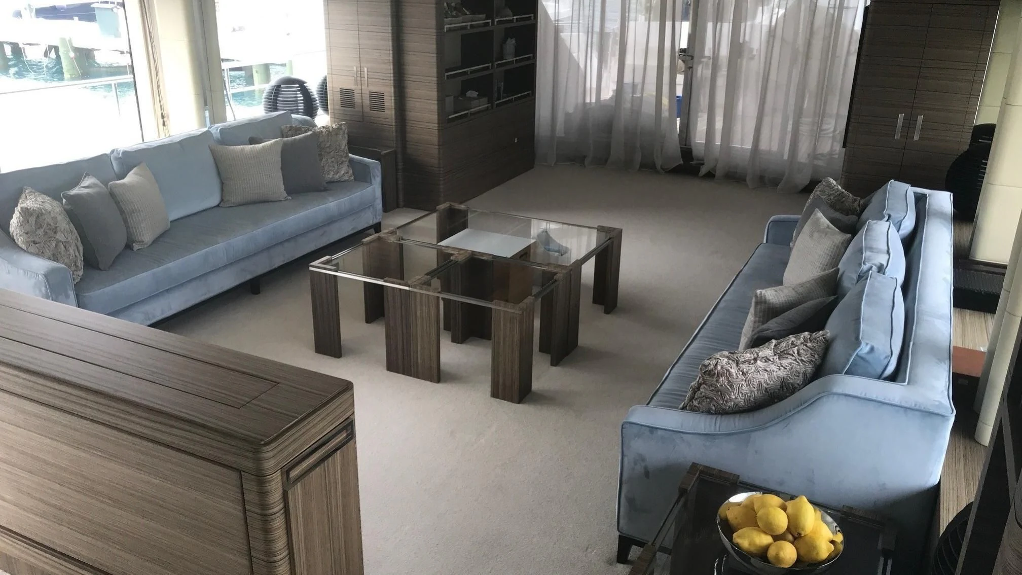 a living room with a couch and a coffee table aboard ORYX Yacht for Sale