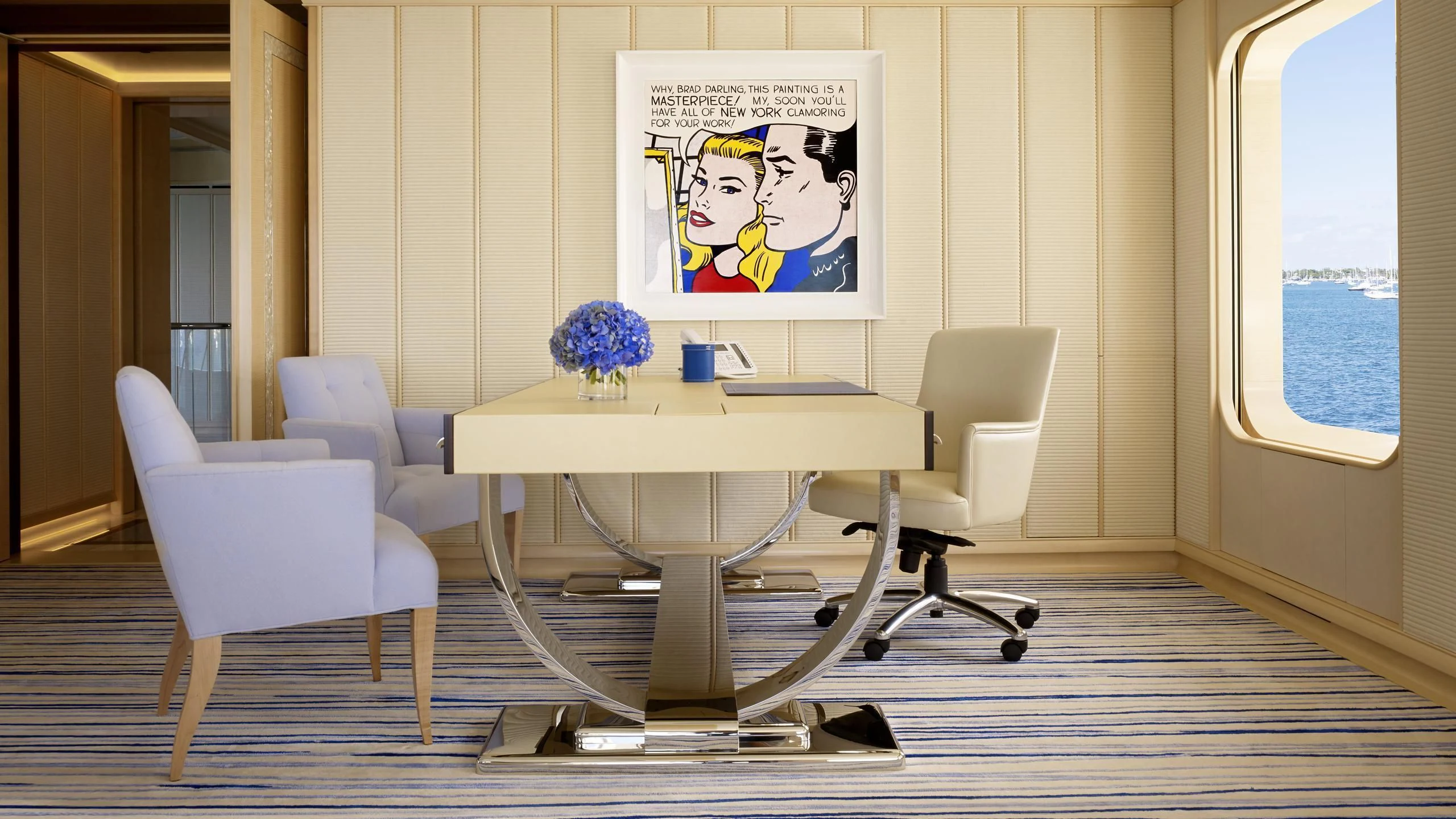 a room with a table and chairs aboard AQUARIUS Yacht for Sale