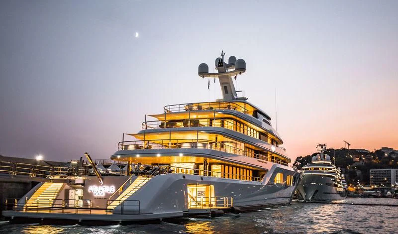a large ship in the water aboard AQUARIUS Yacht for Sale