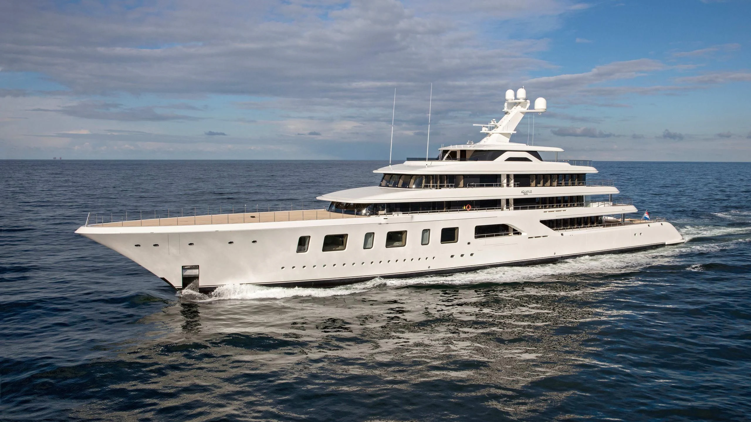 a white yacht in the water aboard AQUARIUS Yacht for Sale