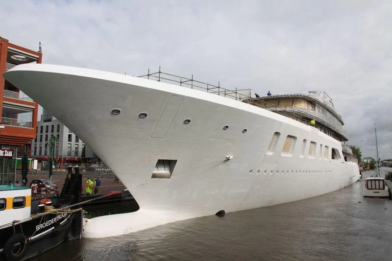a large white ship docked aboard AQUARIUS Yacht for Sale