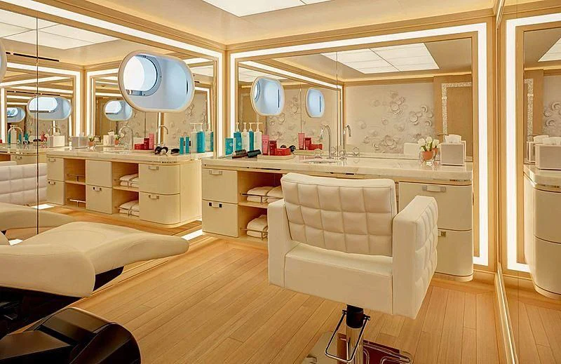 a room with a bed and a sink aboard AQUARIUS Yacht for Sale