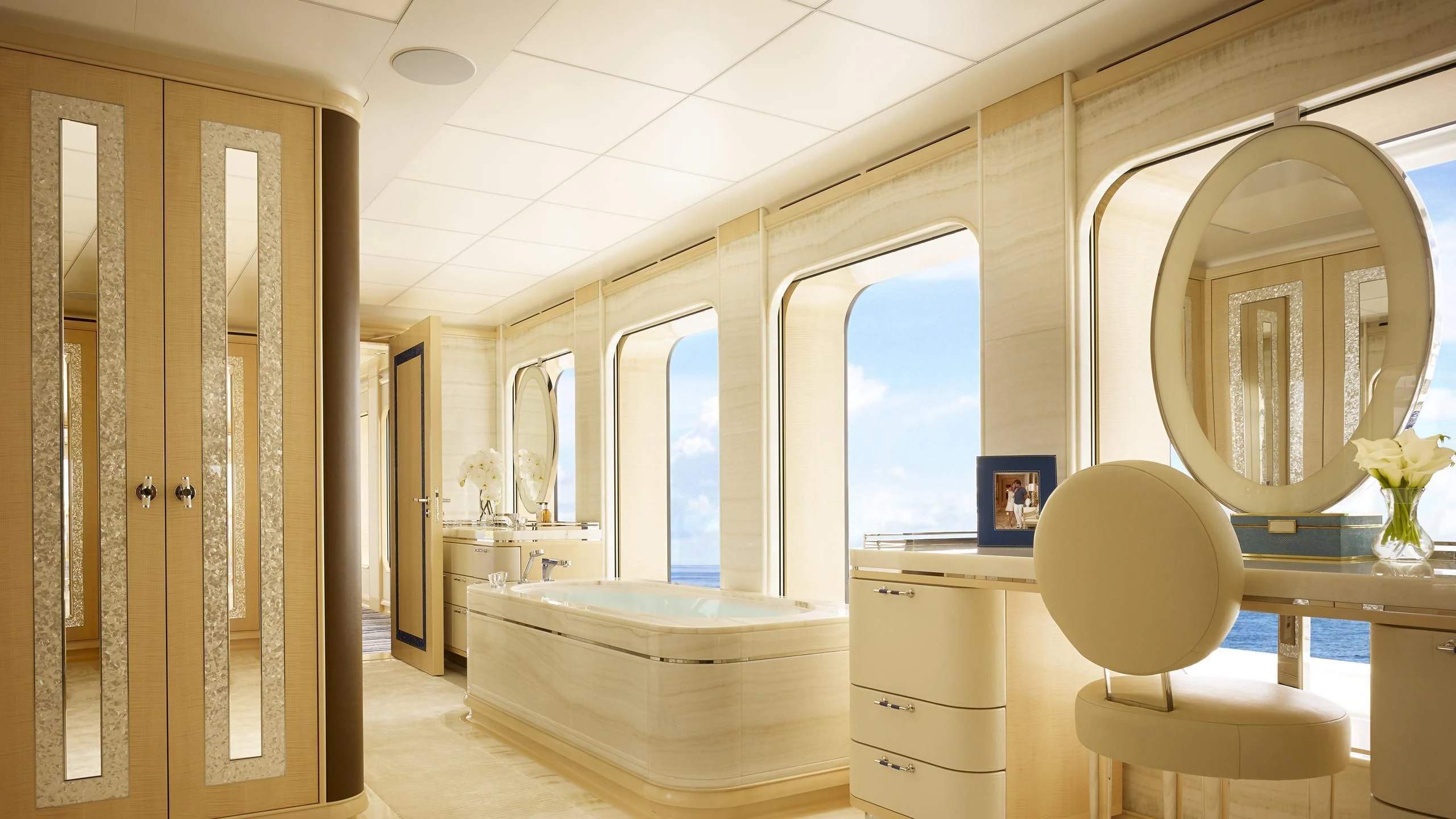 a room with a mirror and a chair aboard AQUARIUS Yacht for Sale