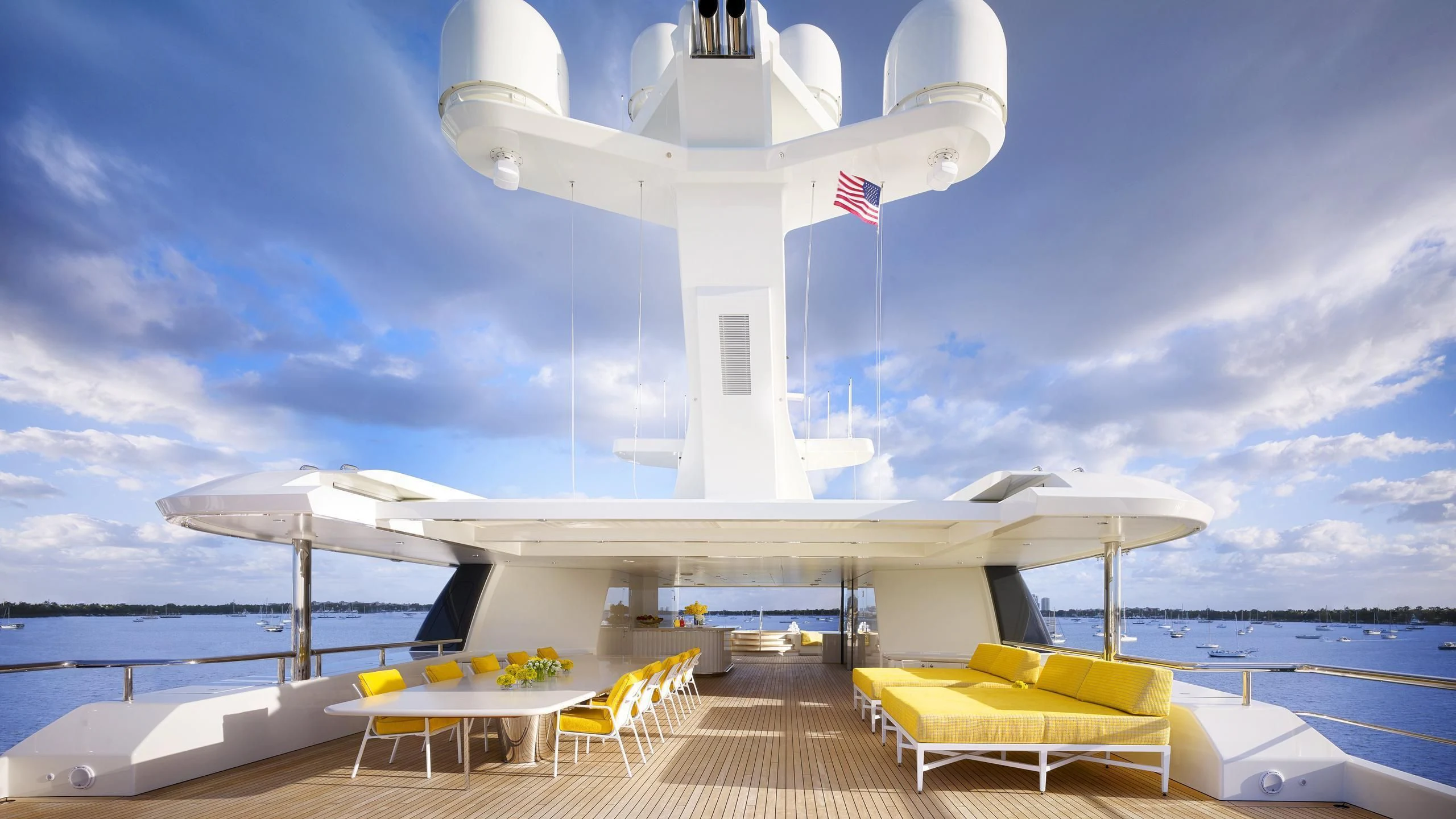 a white building with a flag on the roof aboard AQUARIUS Yacht for Sale