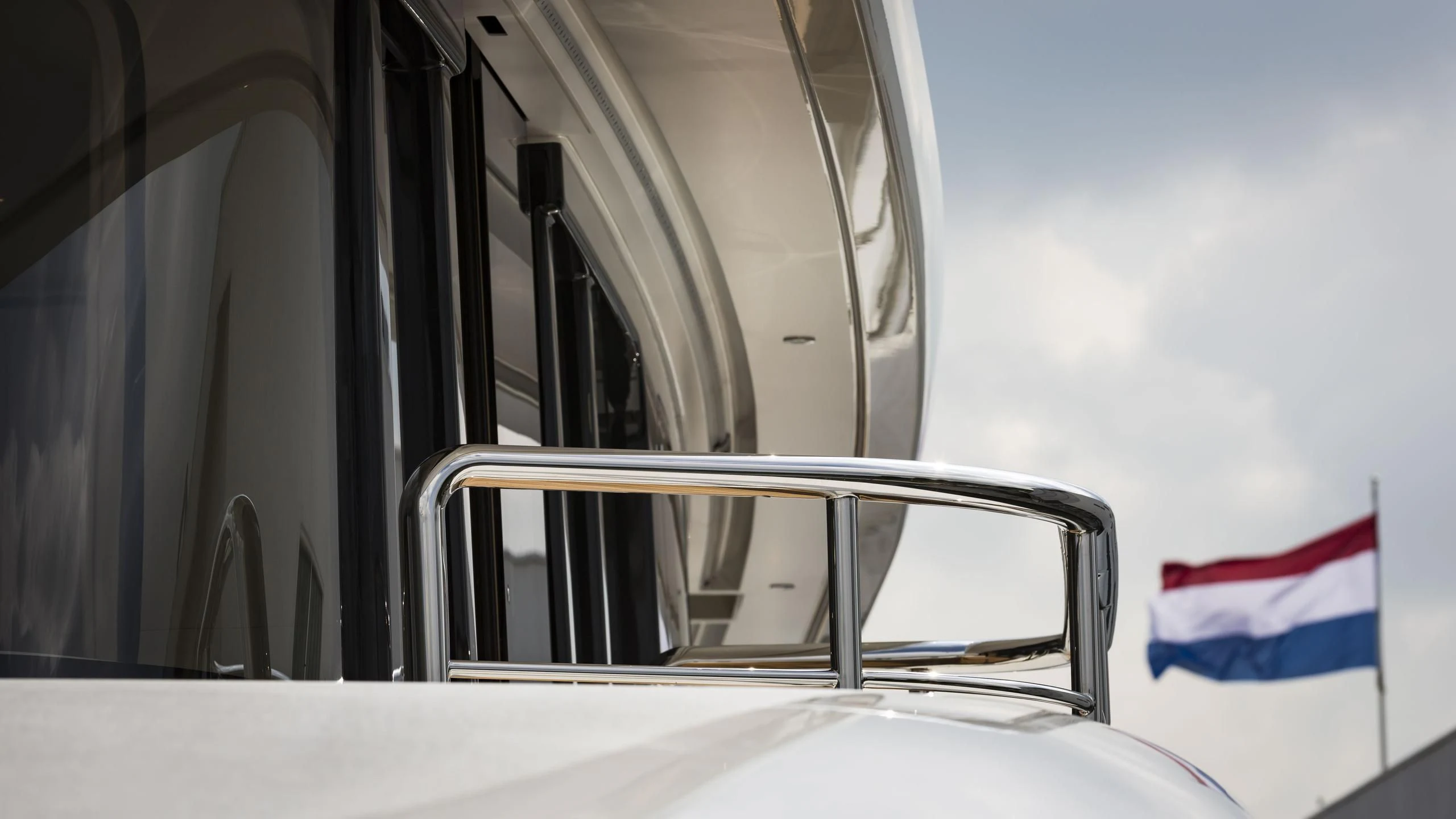 a flag on the back of a boat aboard AQUARIUS Yacht for Sale