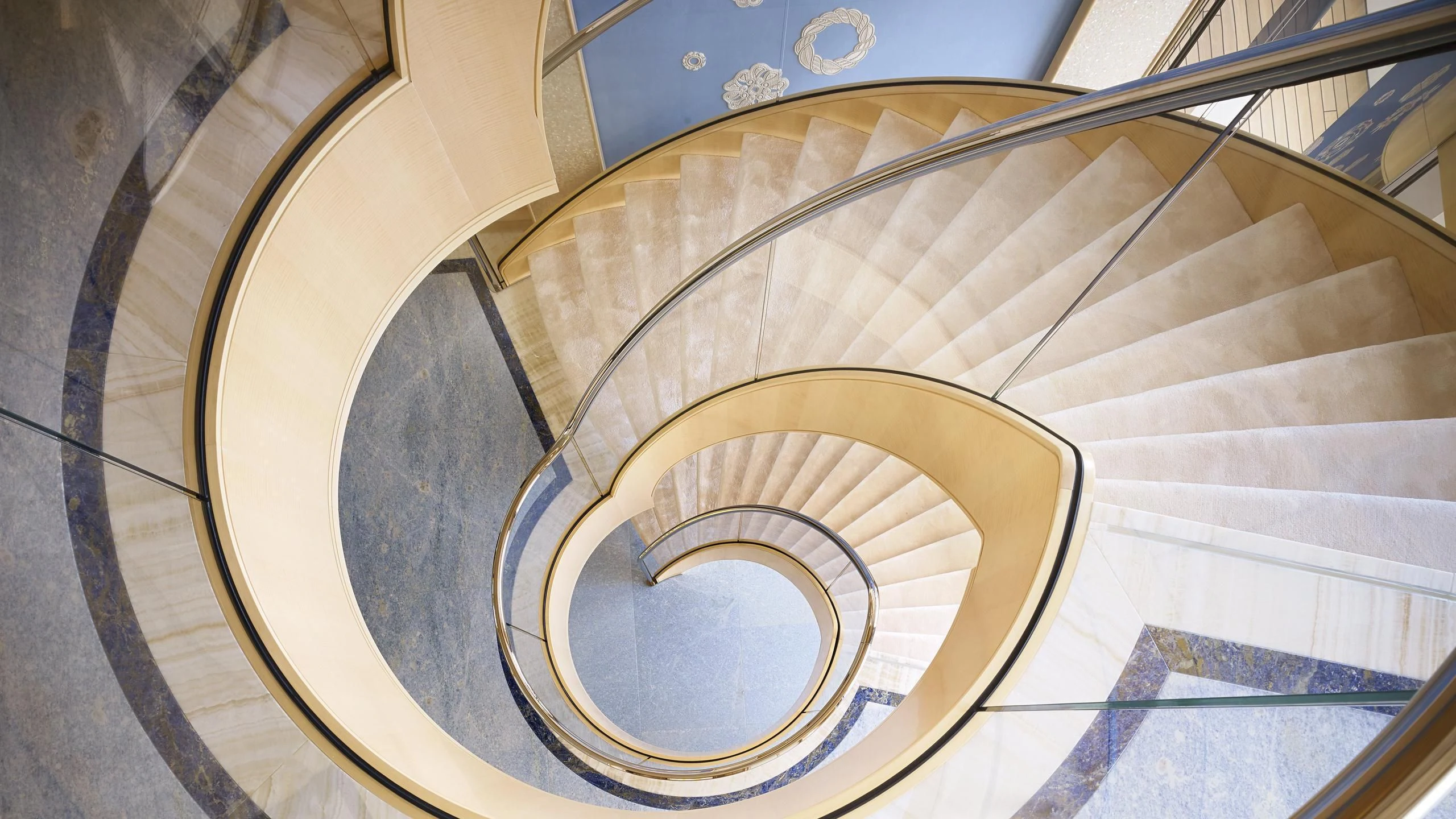 a spiral staircase with a round opening aboard AQUARIUS Yacht for Sale