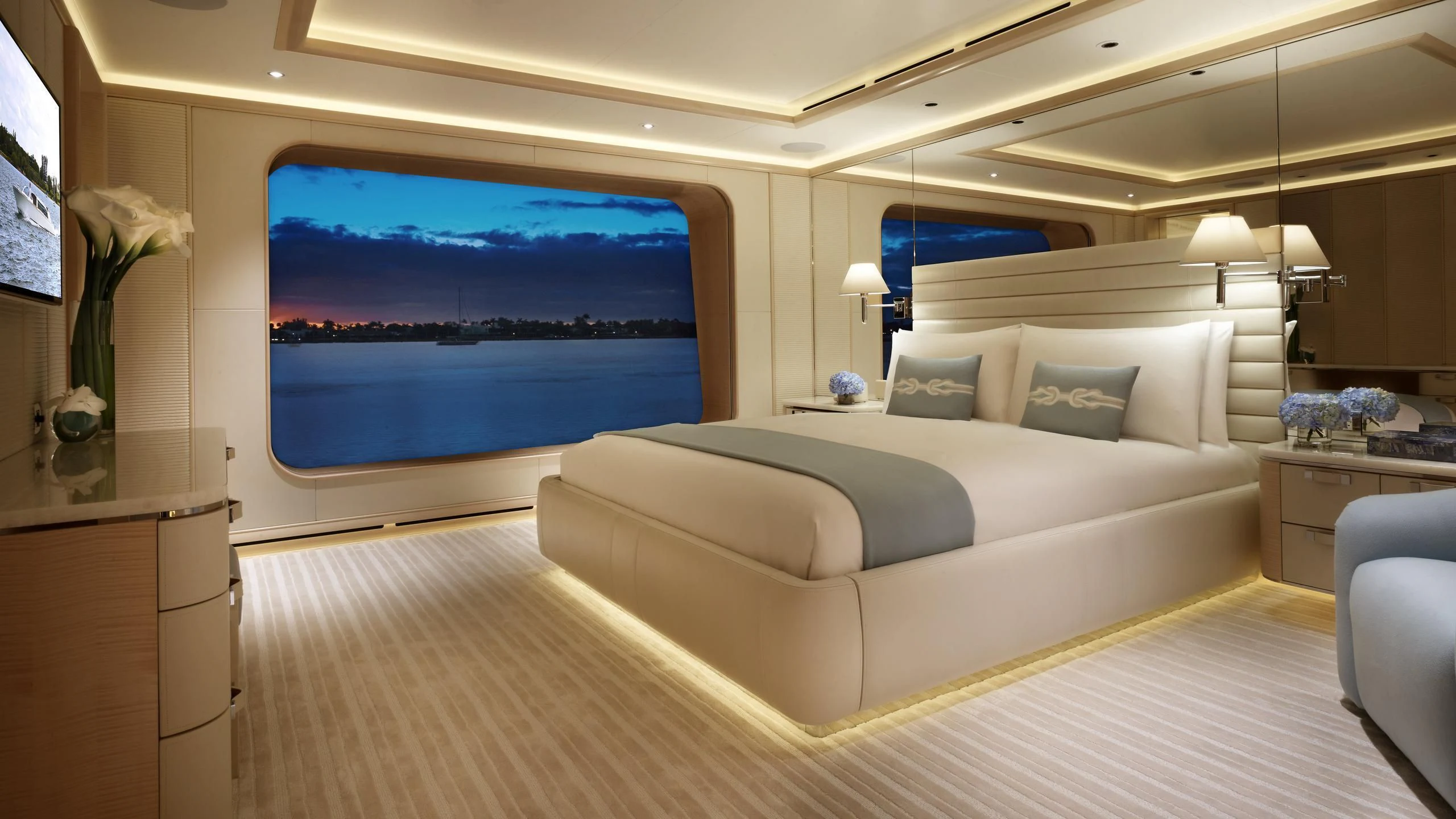 a large bed in a room aboard AQUARIUS Yacht for Sale