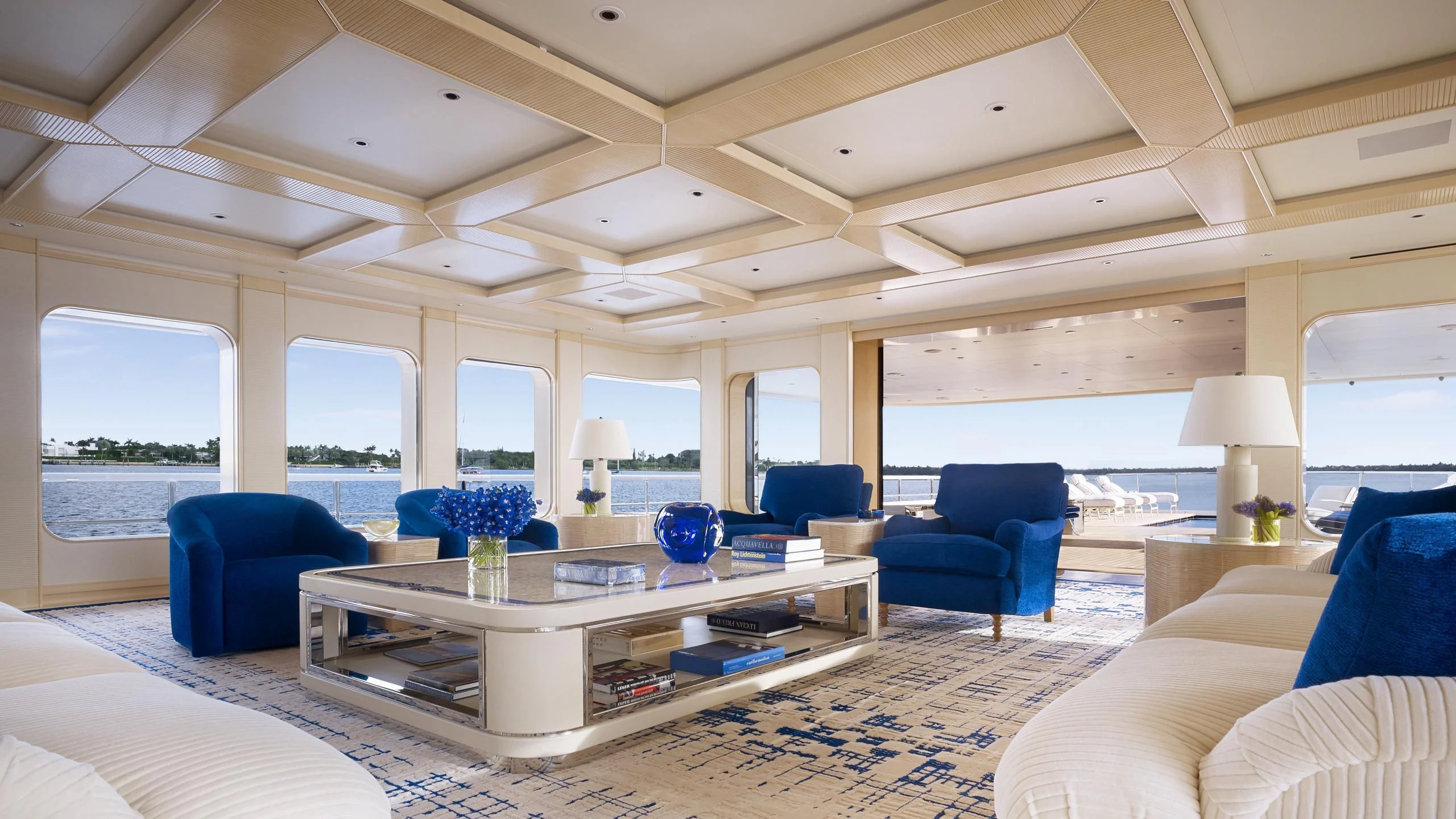 a living room with a large table aboard AQUARIUS Yacht for Sale