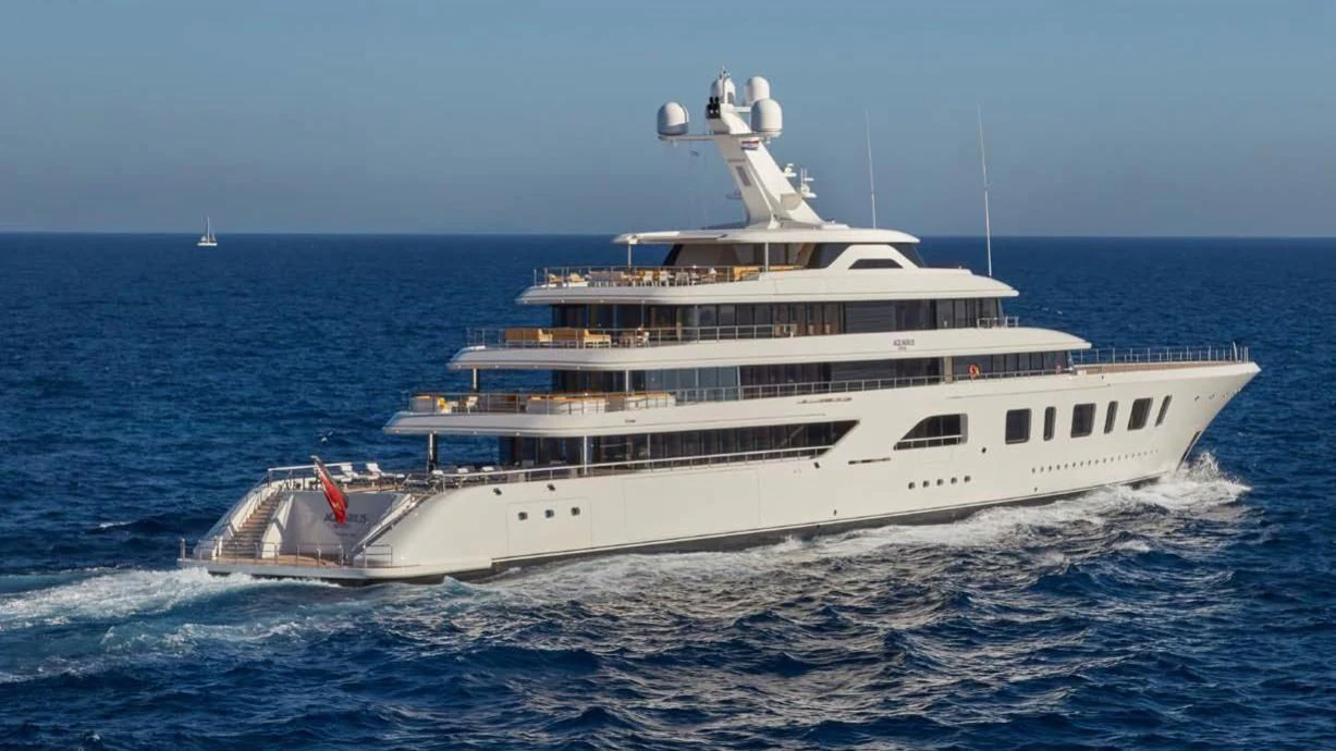 a large white boat in the water aboard AQUARIUS Yacht for Sale