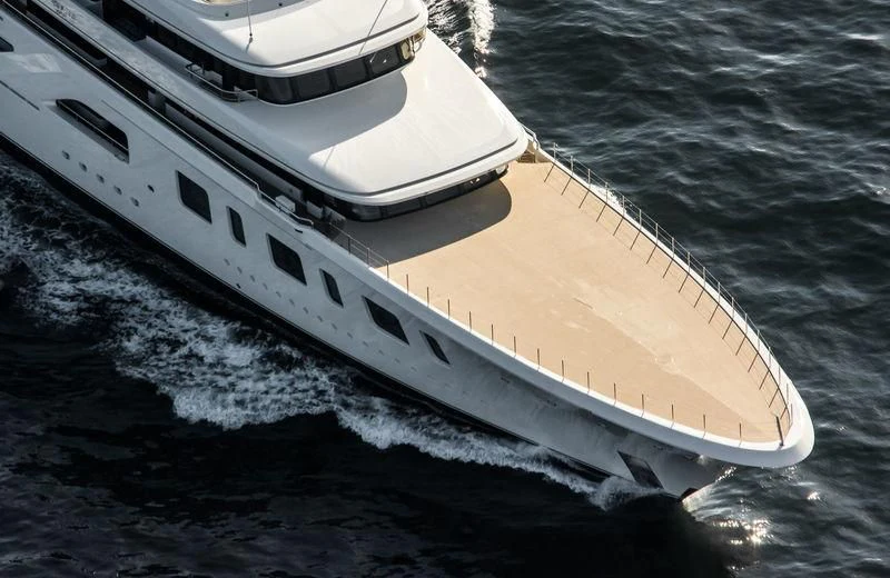 a white boat on the water aboard AQUARIUS Yacht for Sale