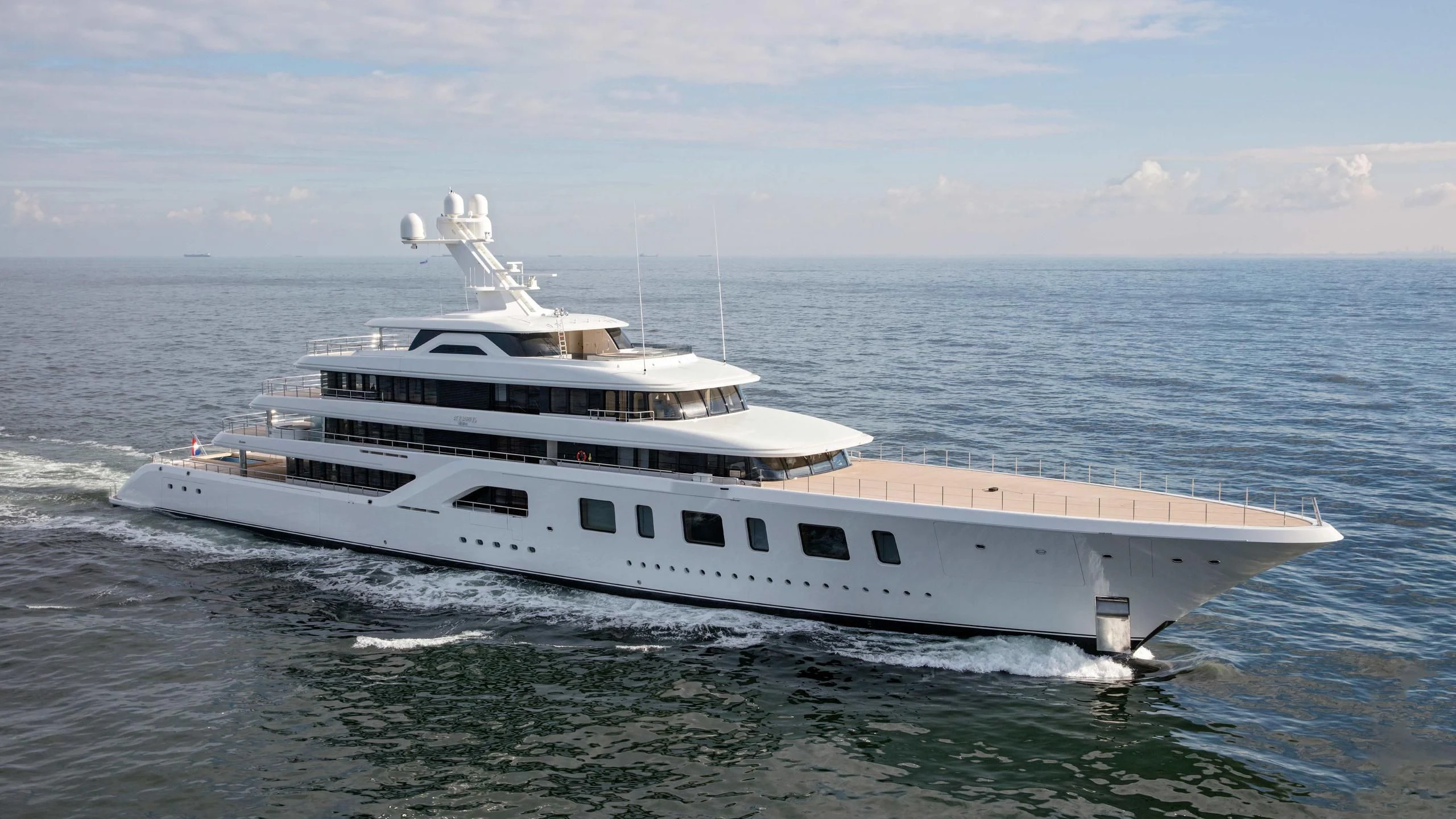 a large white boat in the water aboard AQUARIUS Yacht for Sale