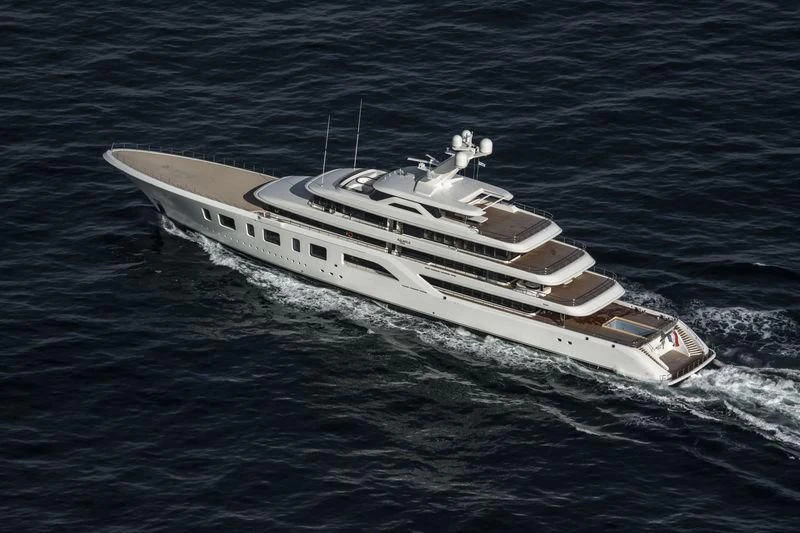 a white boat in the water aboard AQUARIUS Yacht for Sale