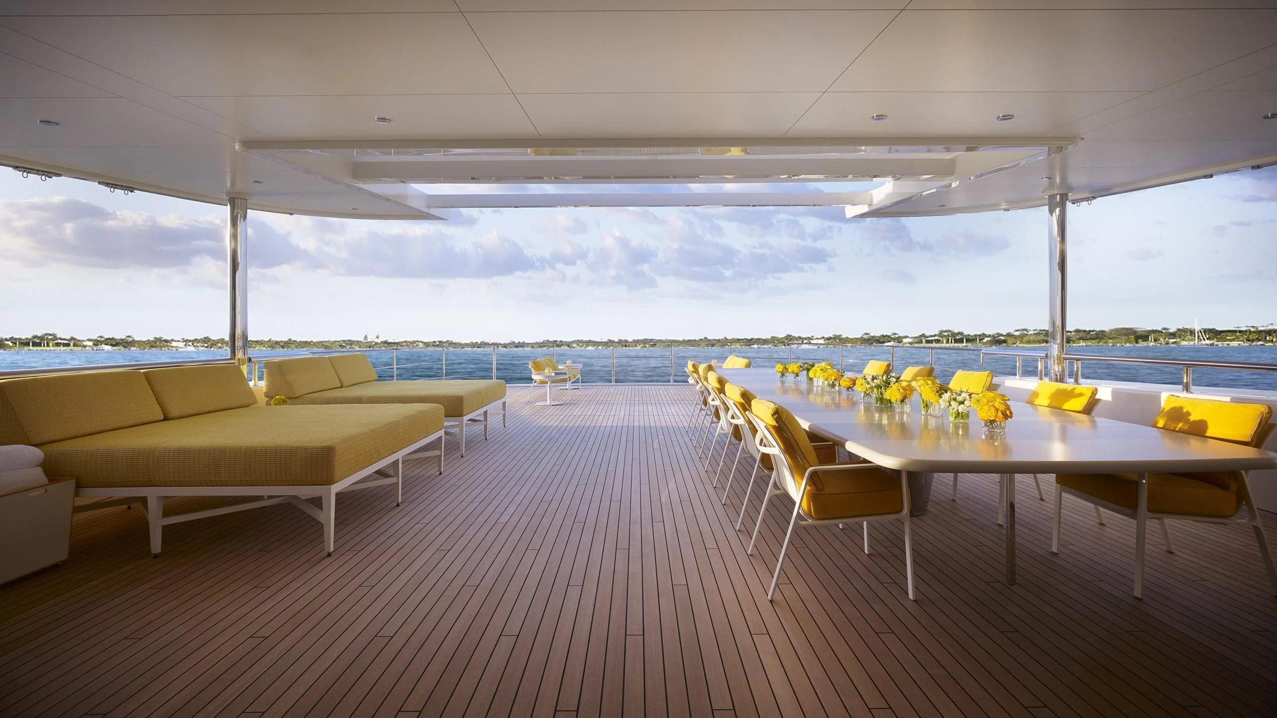 a room with tables and chairs aboard AQUARIUS Yacht for Sale