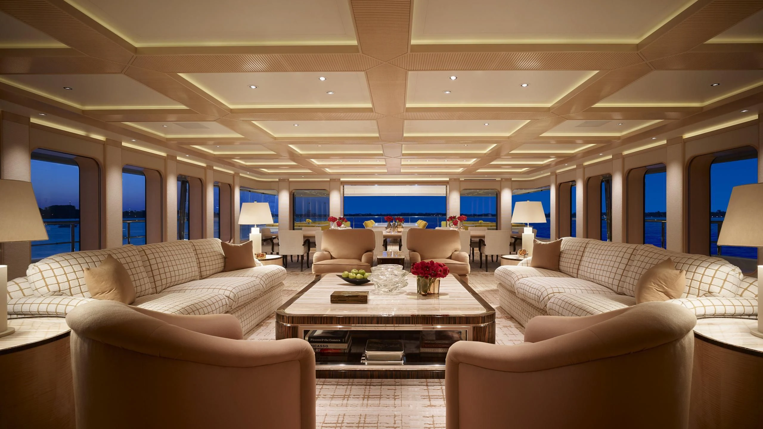 a living room with a table and chairs aboard AQUARIUS Yacht for Sale