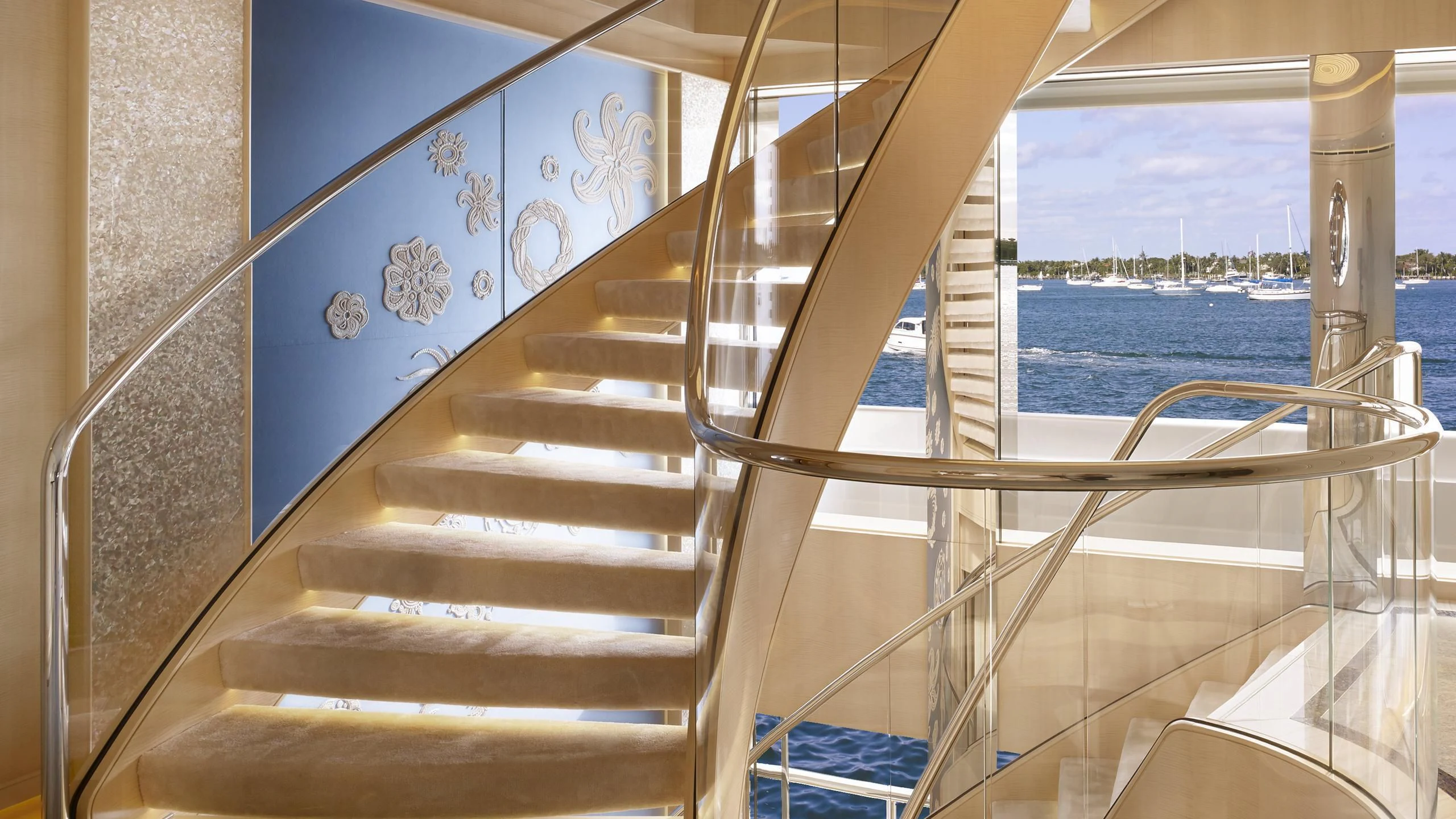 a staircase with a glass window aboard AQUARIUS Yacht for Sale