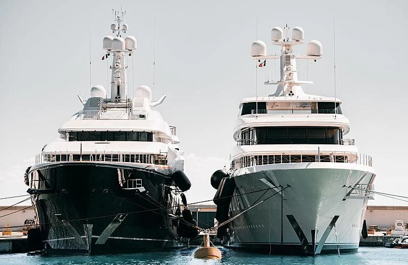 a couple of large boats in the water aboard AQUARIUS Yacht for Sale