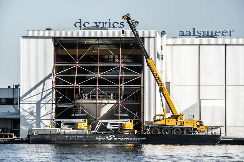 a large building with a crane aboard AQUARIUS Yacht for Sale