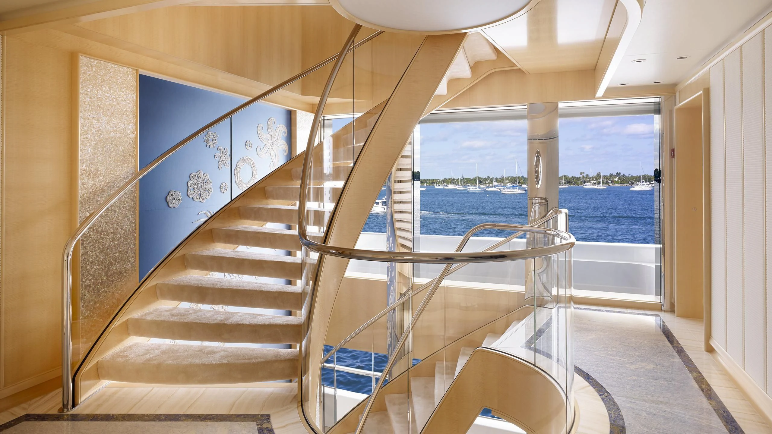 a staircase leading to a balcony aboard AQUARIUS Yacht for Sale