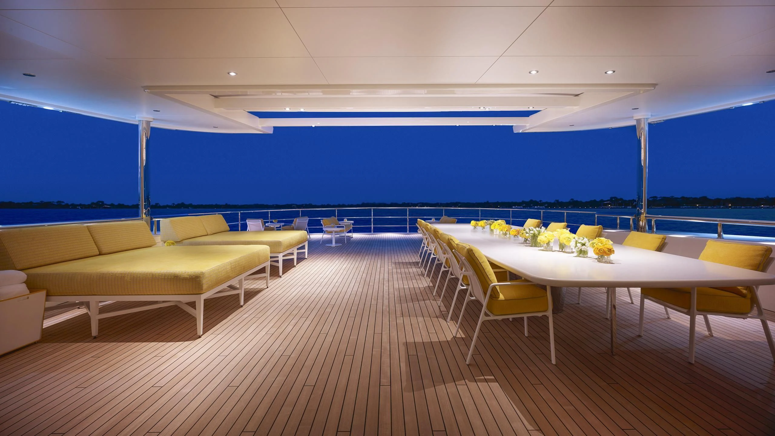 a room with tables and chairs aboard AQUARIUS Yacht for Sale