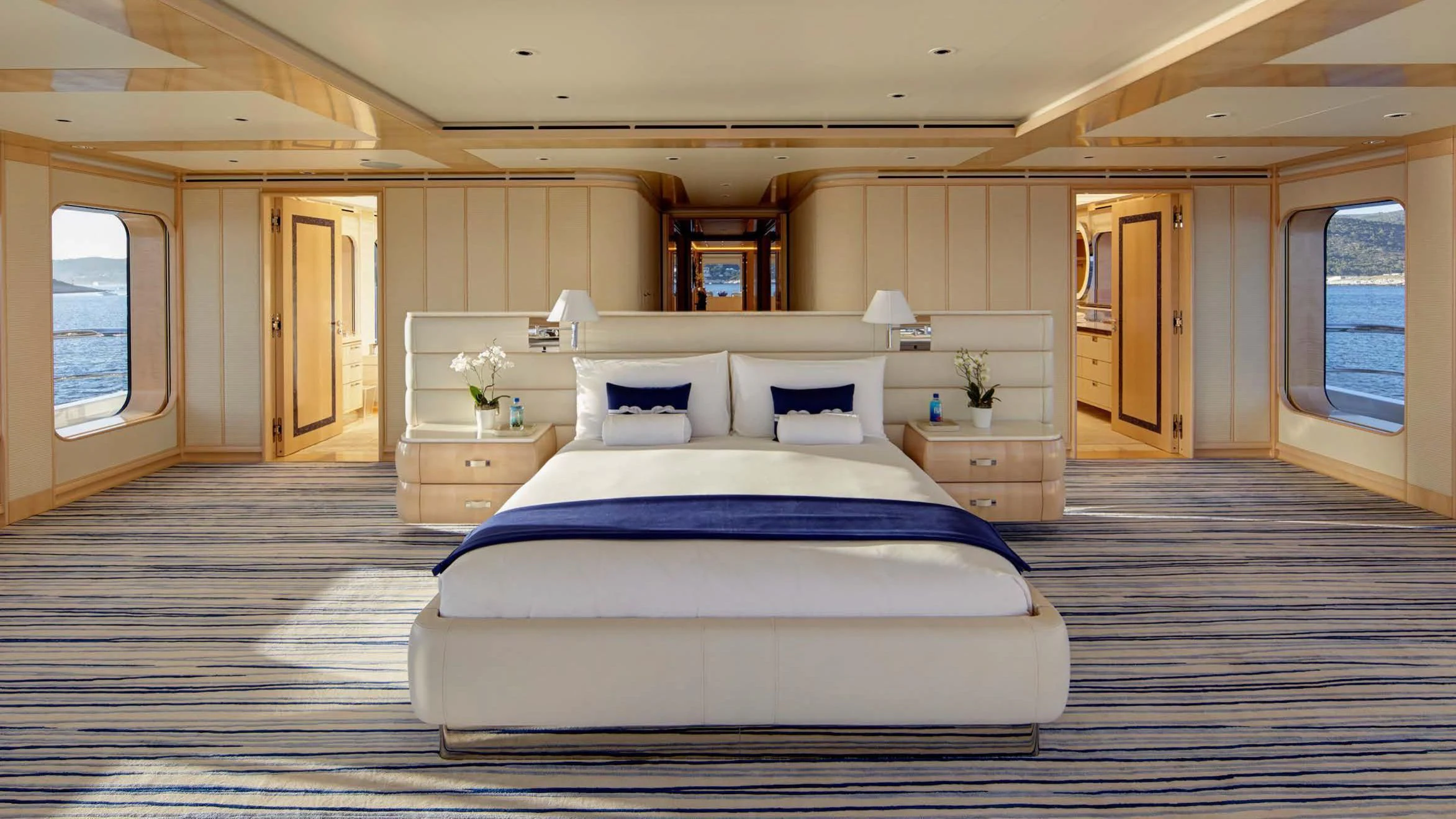 a large bedroom with a large bed aboard AQUARIUS Yacht for Sale