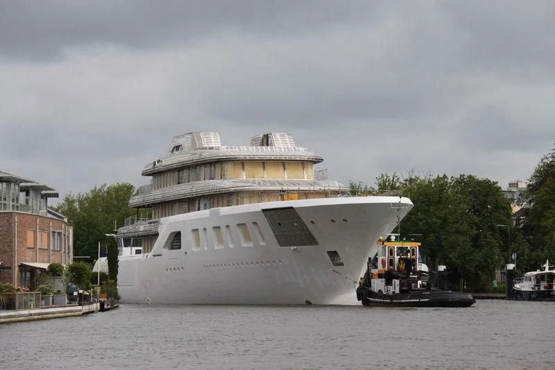 a large white boat on the water aboard AQUARIUS Yacht for Sale
