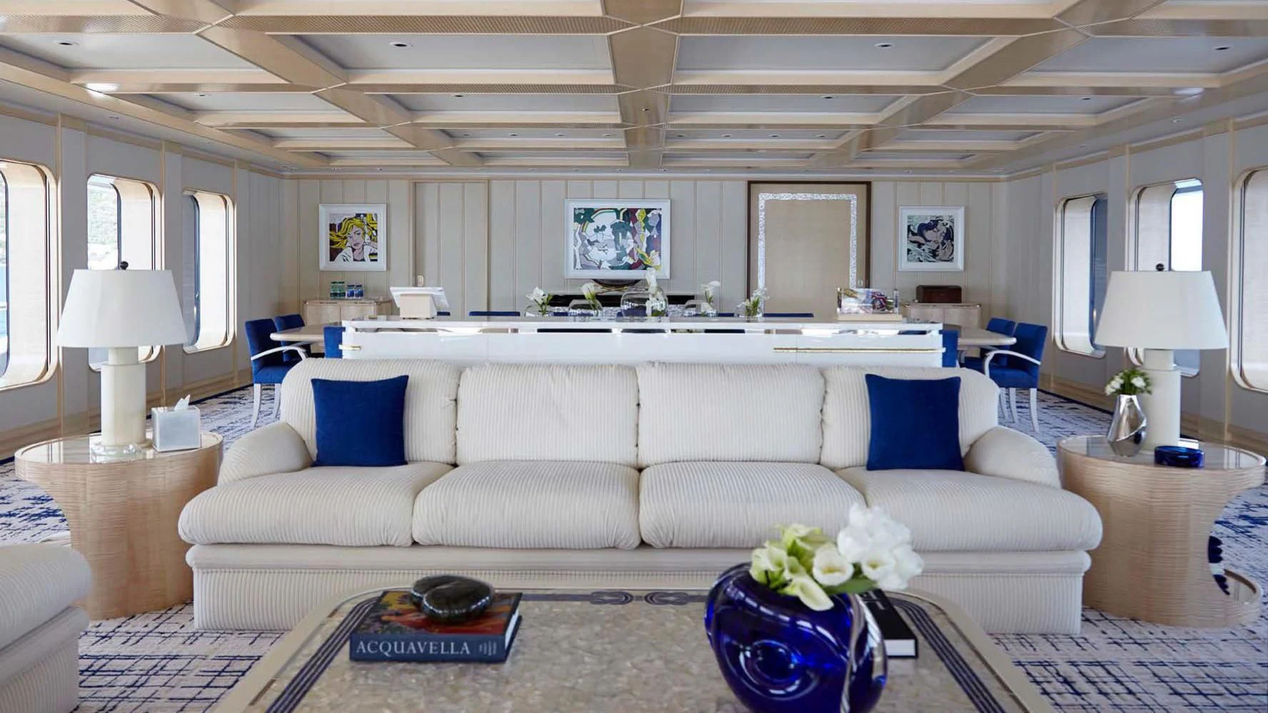 a living room with a white couch aboard AQUARIUS Yacht for Sale