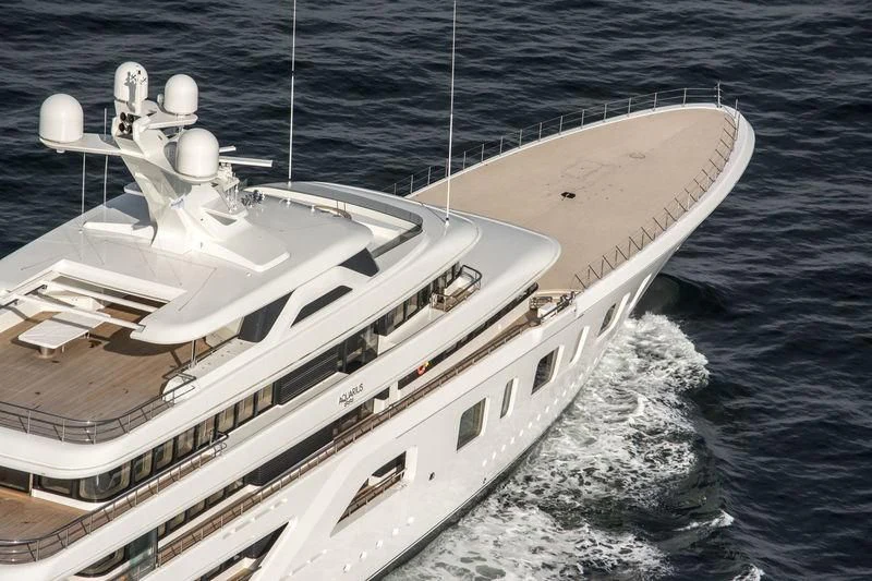 a large white ship in the water aboard AQUARIUS Yacht for Sale