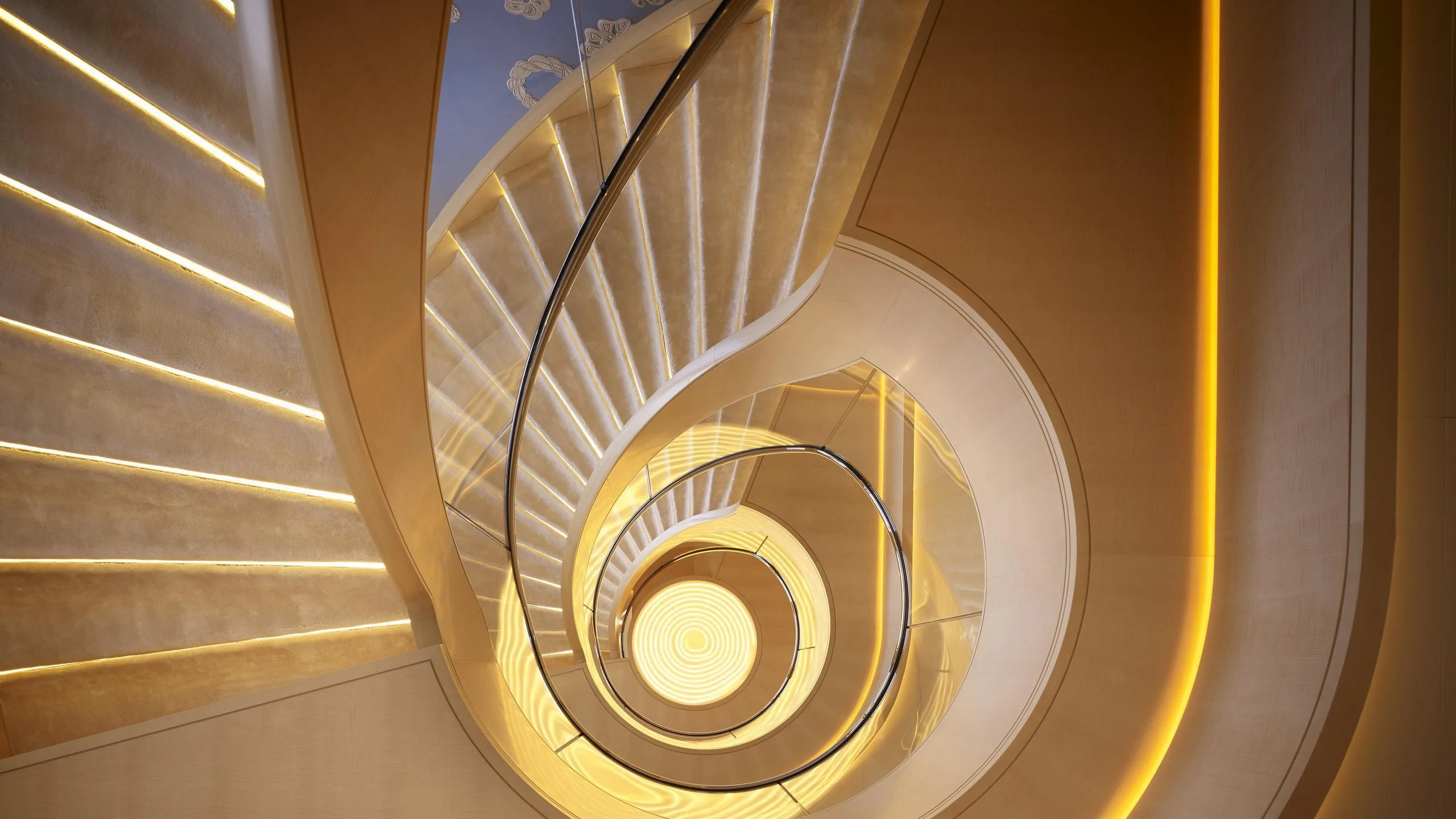 a spiral staircase with a light aboard AQUARIUS Yacht for Sale