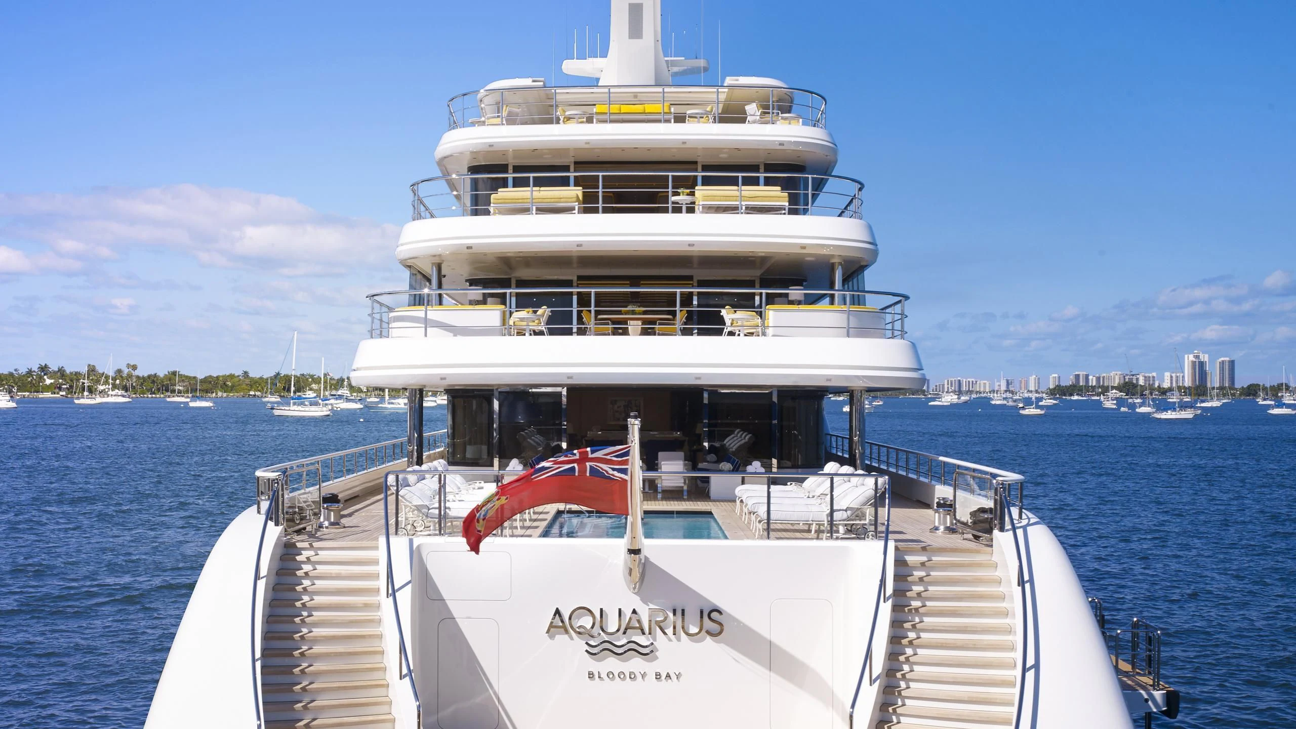 a large white boat on a body of water aboard AQUARIUS Yacht for Sale