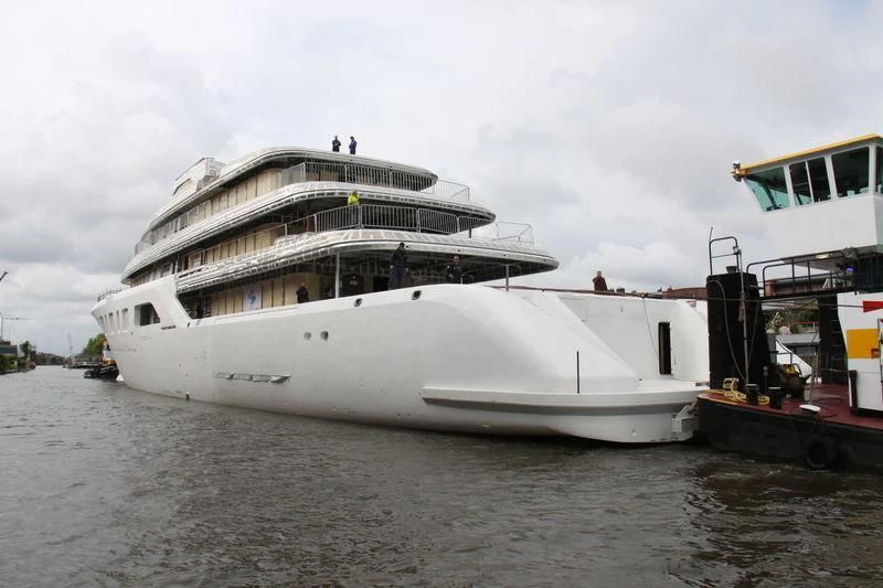 a large white boat docked aboard AQUARIUS Yacht for Sale