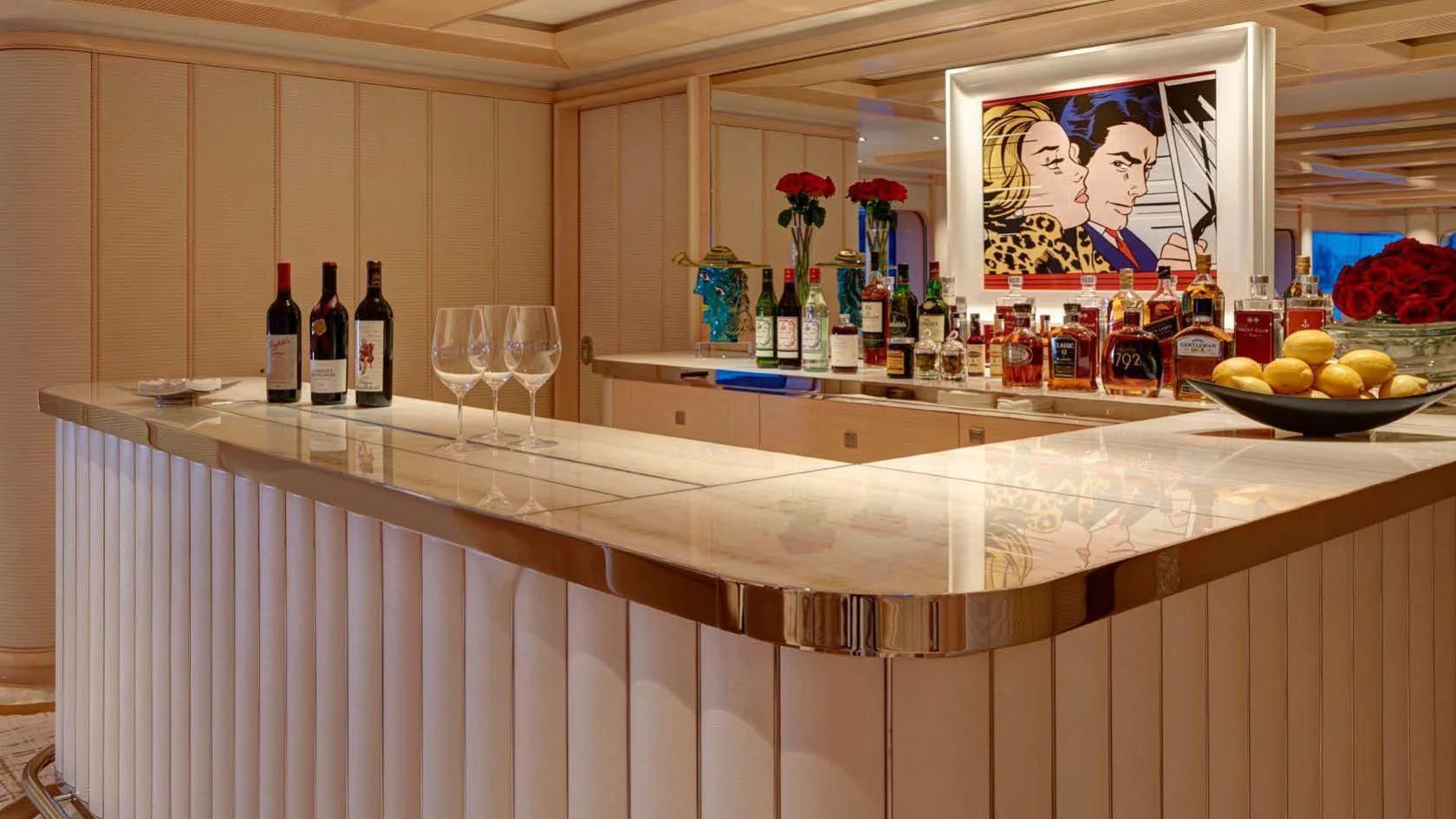a kitchen counter with wine bottles aboard AQUARIUS Yacht for Sale