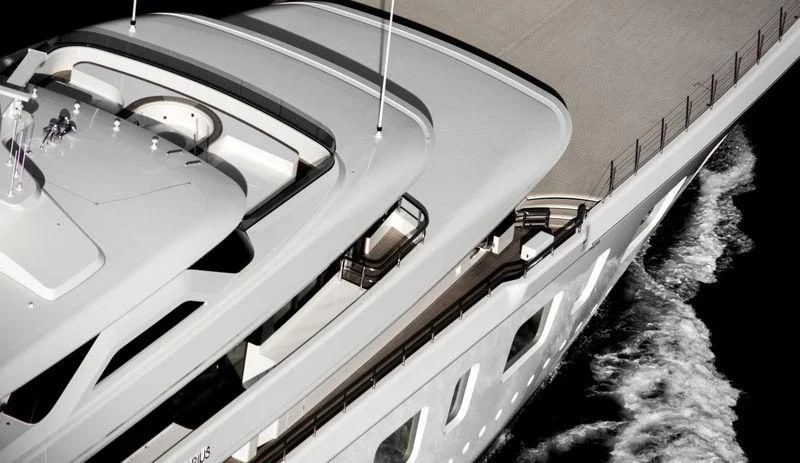 a plane in the sky aboard AQUARIUS Yacht for Sale