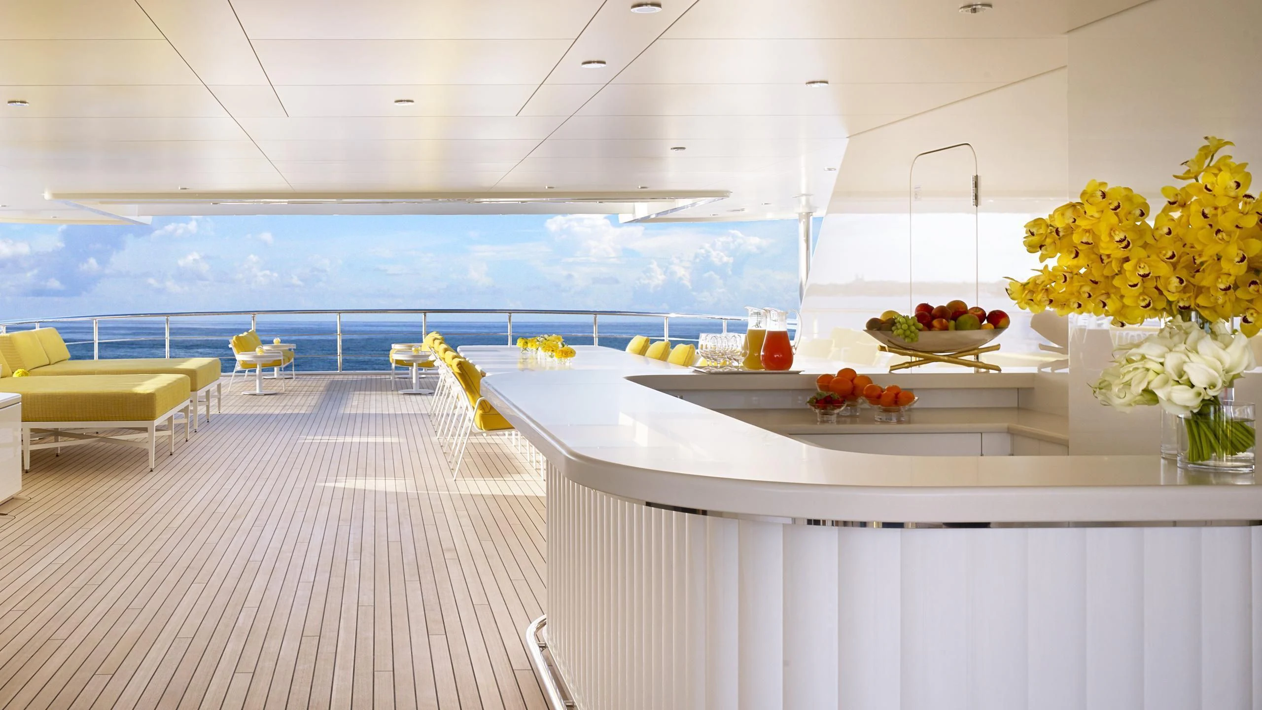 a room with a table and chairs aboard AQUARIUS Yacht for Sale