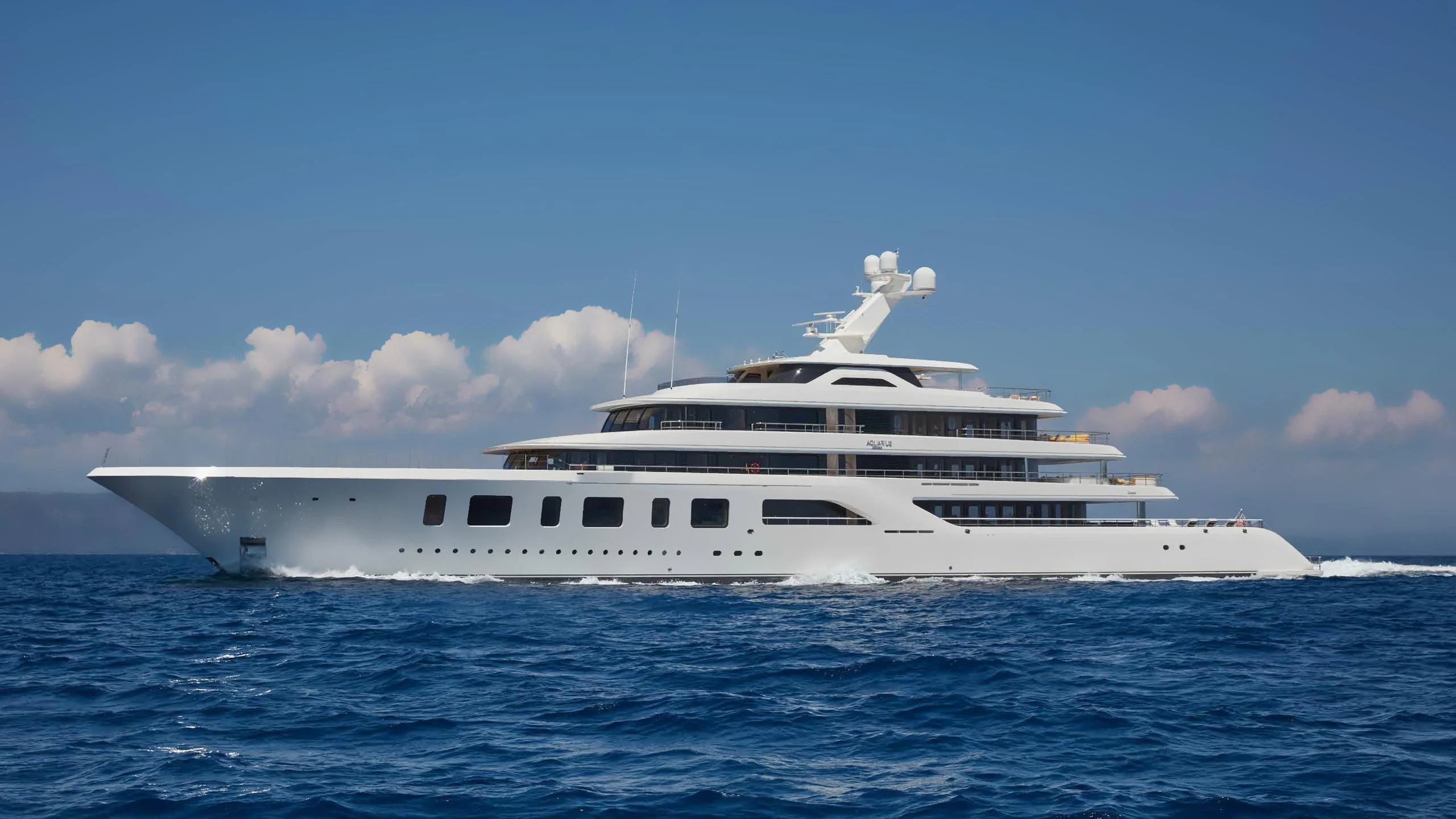 a white yacht in the water aboard AQUARIUS Yacht for Sale