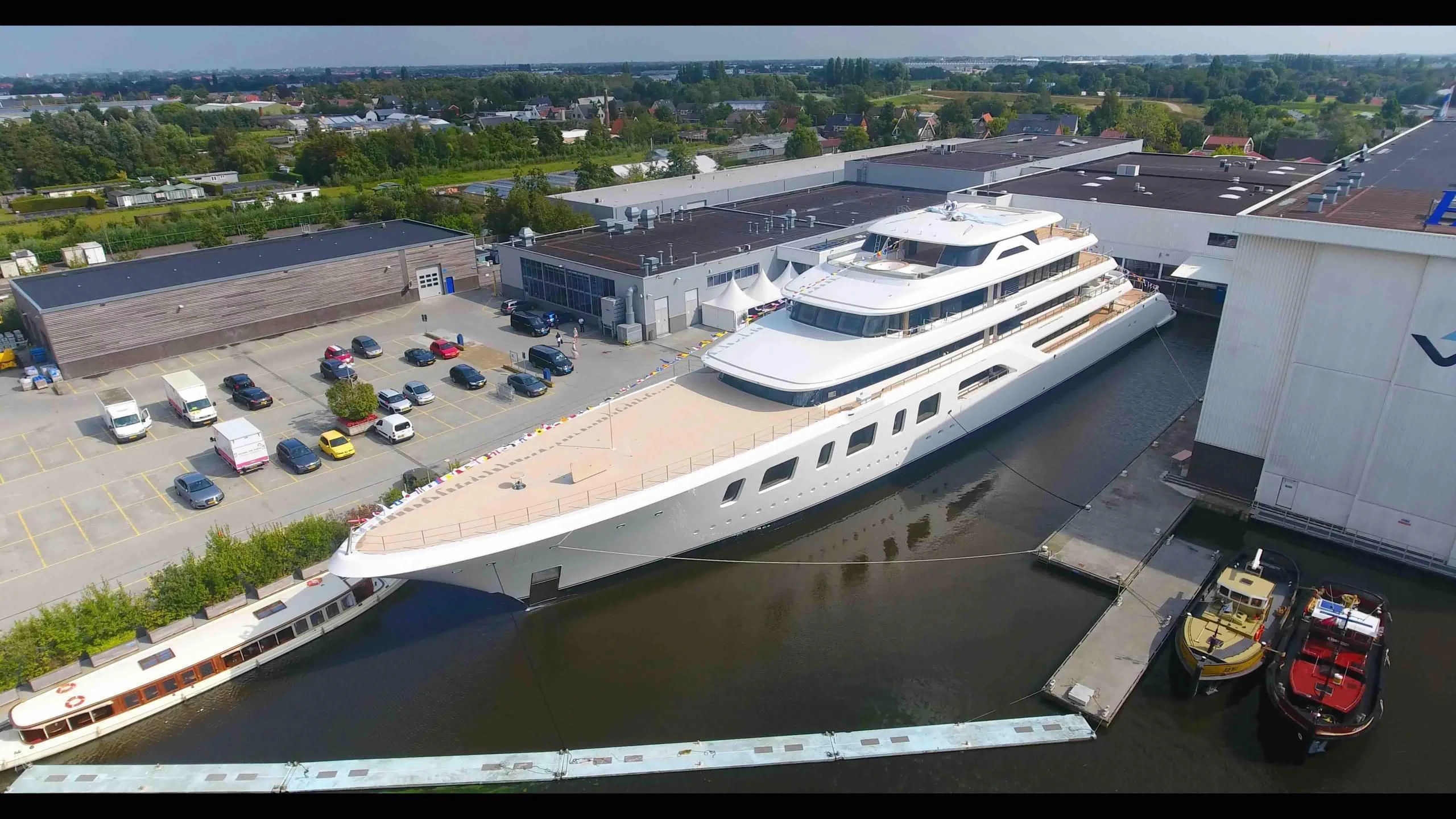 a large white ship docked aboard AQUARIUS Yacht for Sale